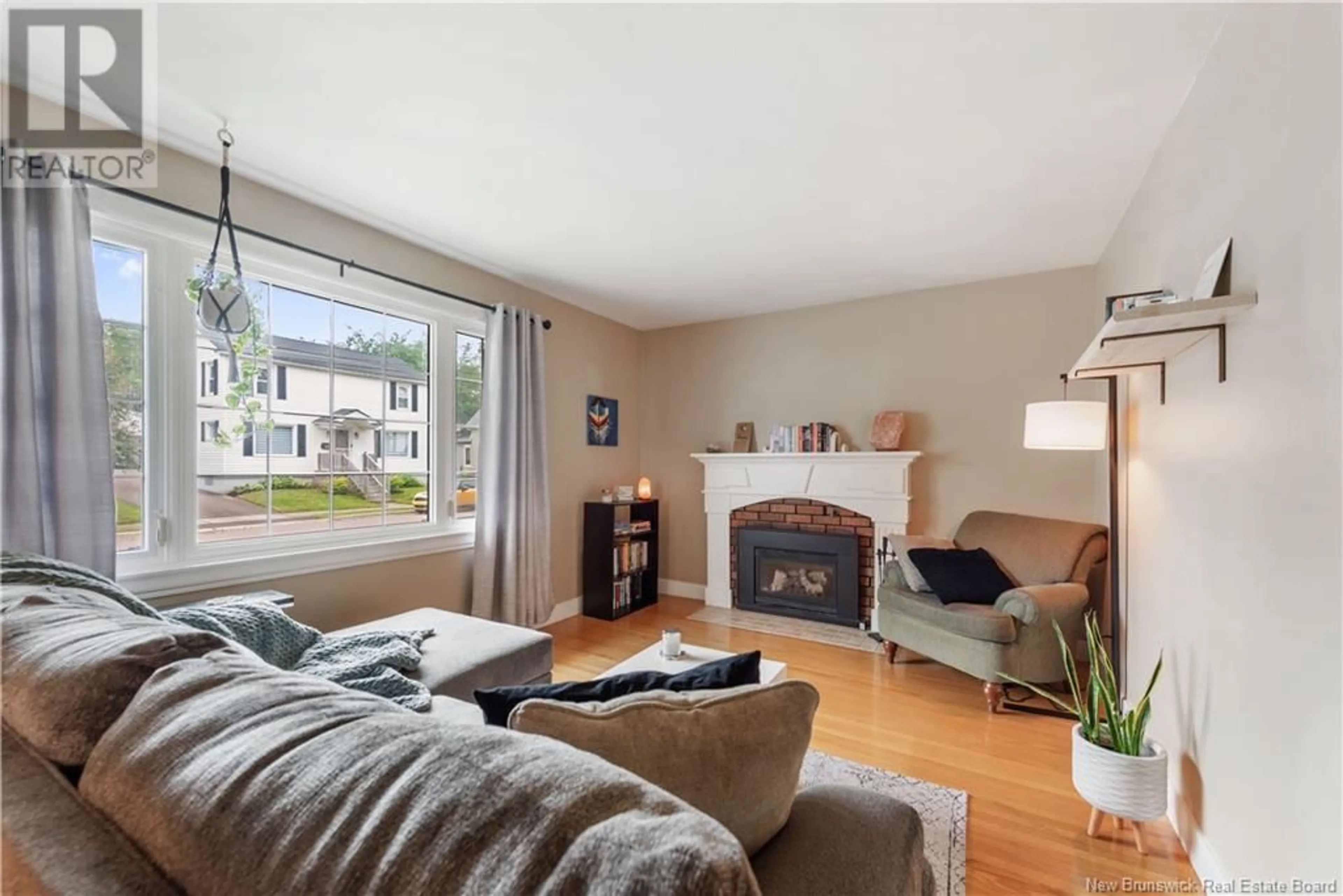 Living room with furniture, wood/laminate floor for 133 MAPLE STREET, Moncton New Brunswick E1C6A5
