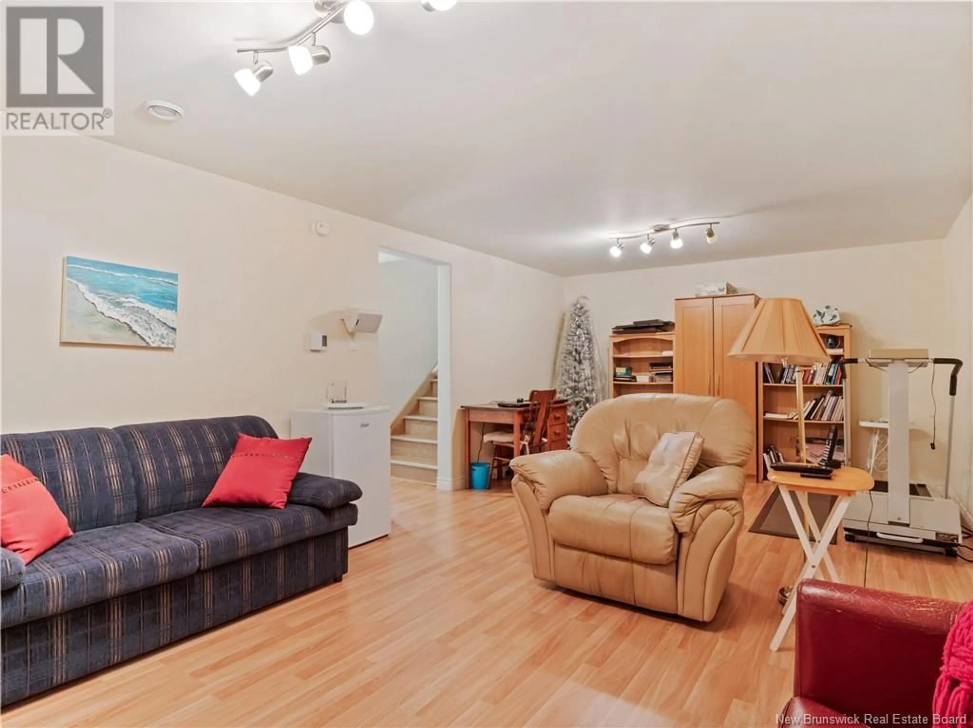 Living room with furniture, wood/laminate floor for 5 - 114 DOMETHILDE, Dieppe New Brunswick E1A8R3