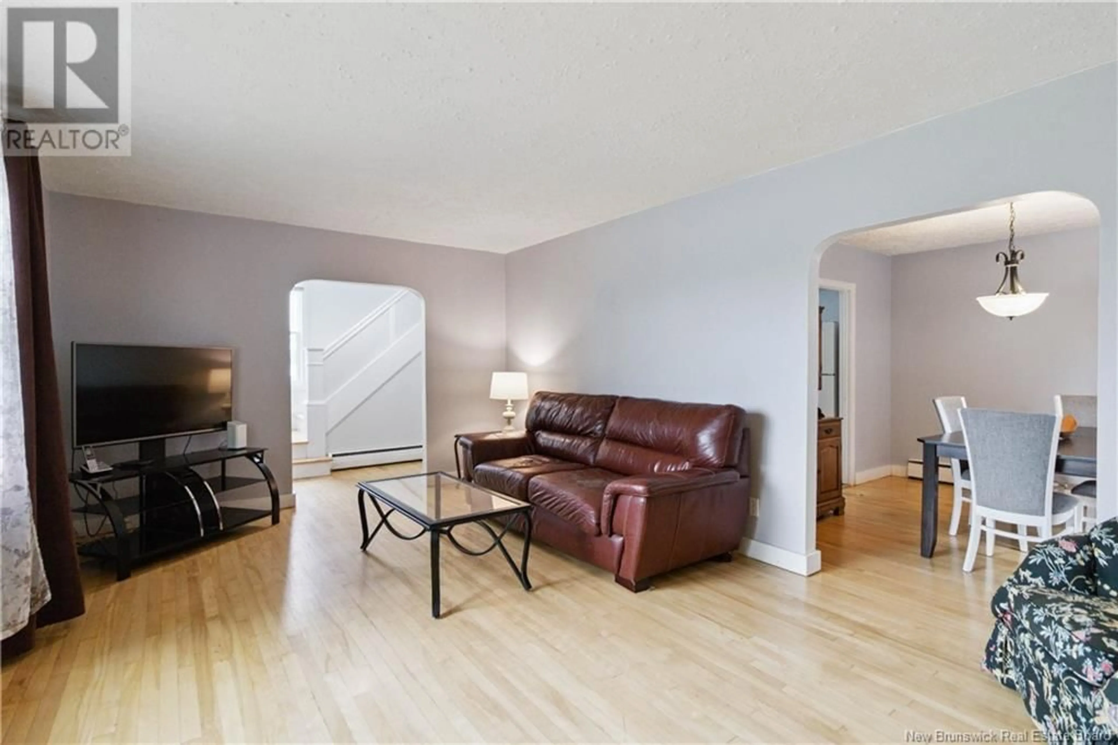 Living room with furniture, wood/laminate floor for 75 ELLERDALE AVENUE, Moncton New Brunswick E1A3M8
