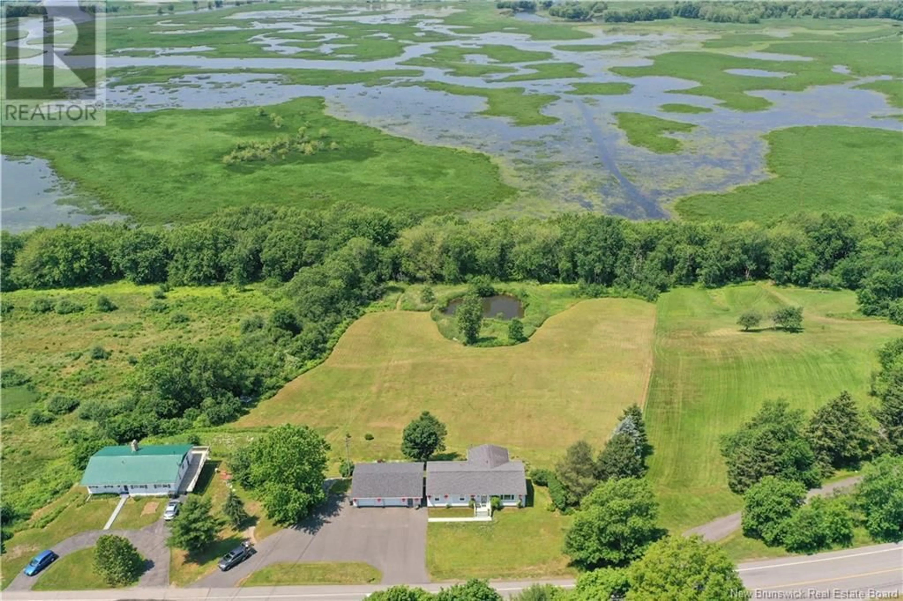 A pic from outside/outdoor area/front of a property/back of a property/a pic from drone, water/lake/river/ocean view for 376 KENNEBECASIS RIVER ROAD, Hampton New Brunswick E5N6P3