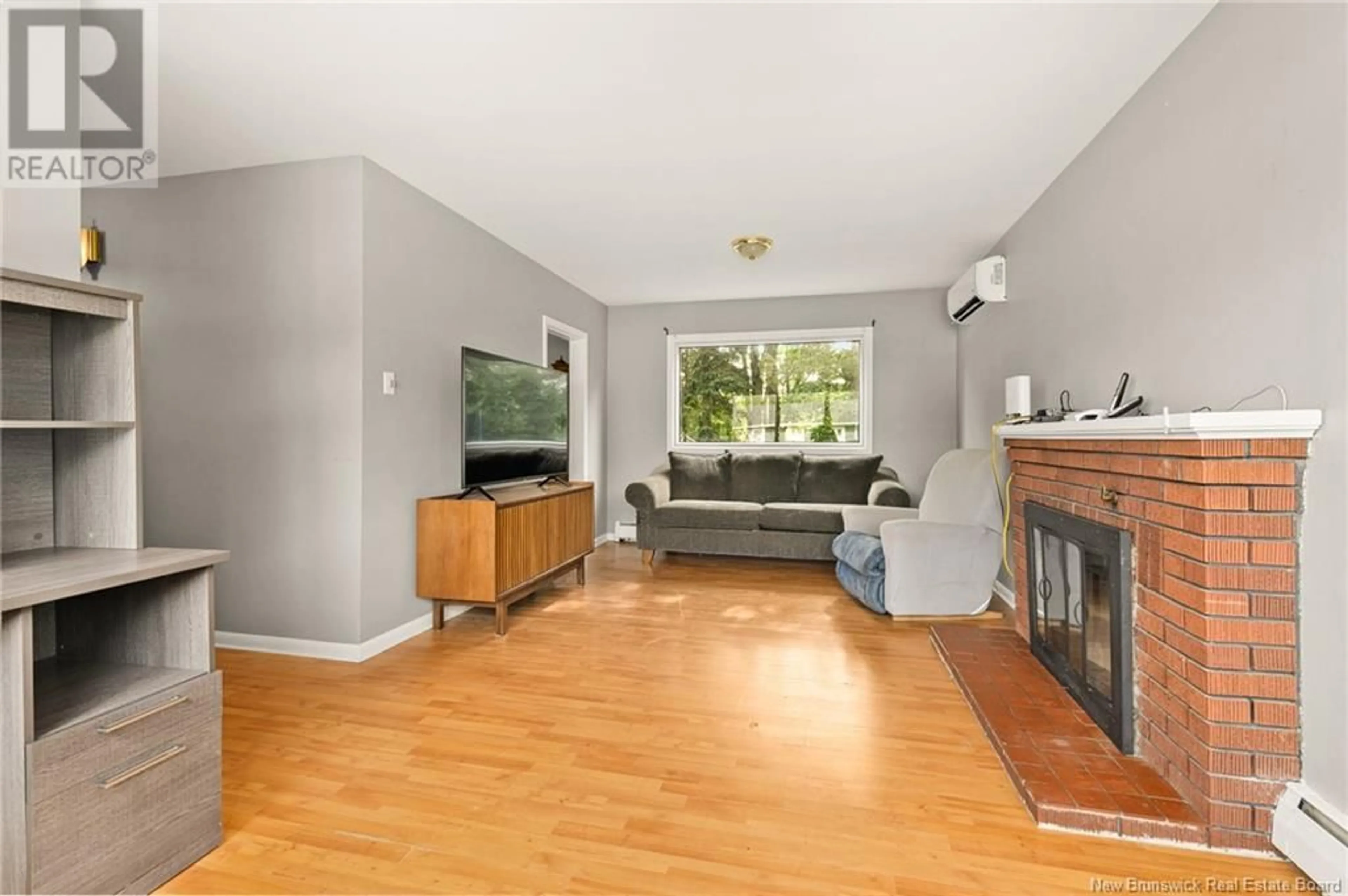 Living room with furniture, wood/laminate floor for 42 MILROTH, Moncton New Brunswick E1A4L1