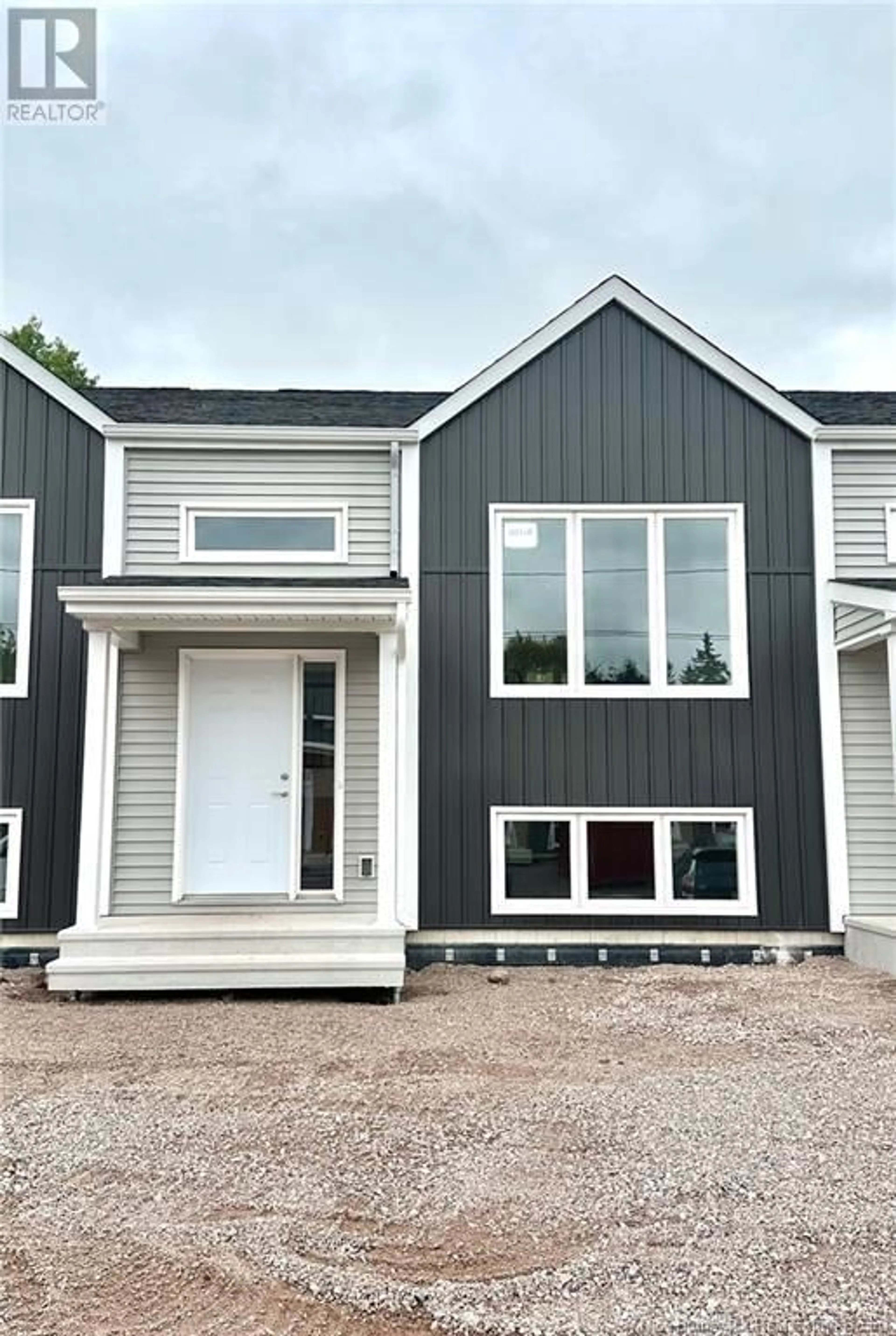 Home with vinyl exterior material, street for 303 ELSLIGER STREET, Dieppe New Brunswick E1K0A5