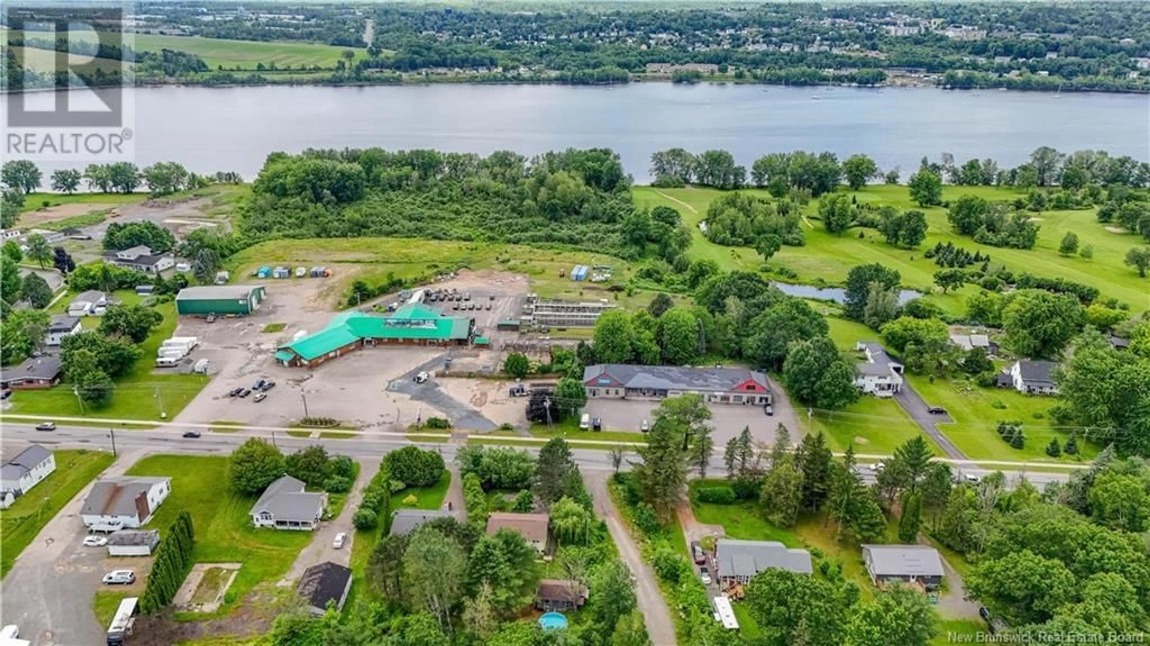 A pic from outside/outdoor area/front of a property/back of a property/a pic from drone, water/lake/river/ocean view for 661 RIVERSIDE DRIVE, Fredericton New Brunswick E3A8L2