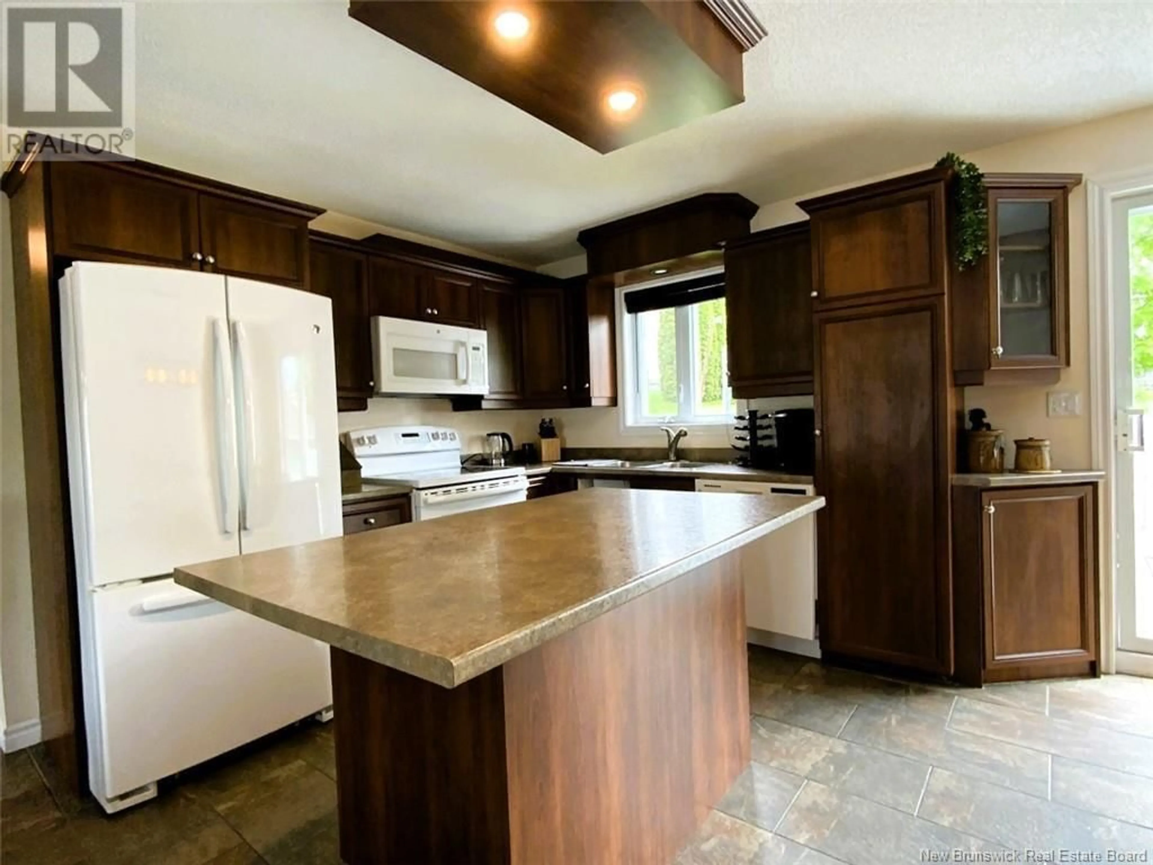 Open concept kitchen, ceramic/tile floor for 133 CHEMIN DU POUVOIR ROAD, Edmundston New Brunswick E3V2Y2