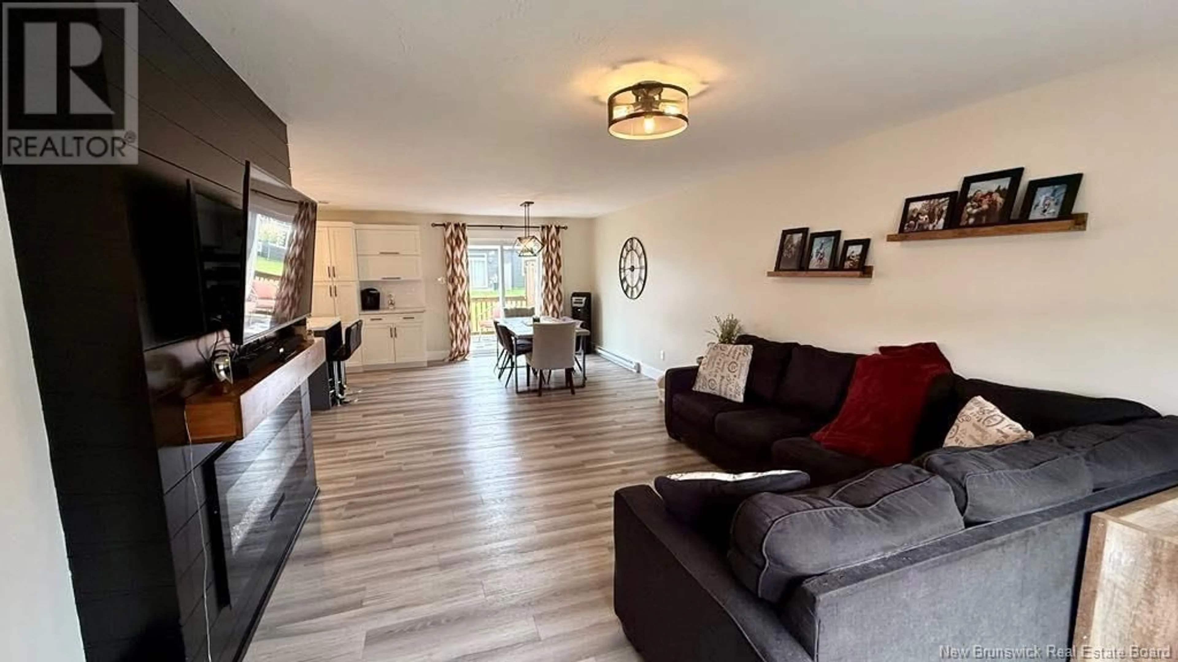 Living room with furniture, wood/laminate floor for 148 RUE MELANIE STREET, Dieppe New Brunswick E1A6N4
