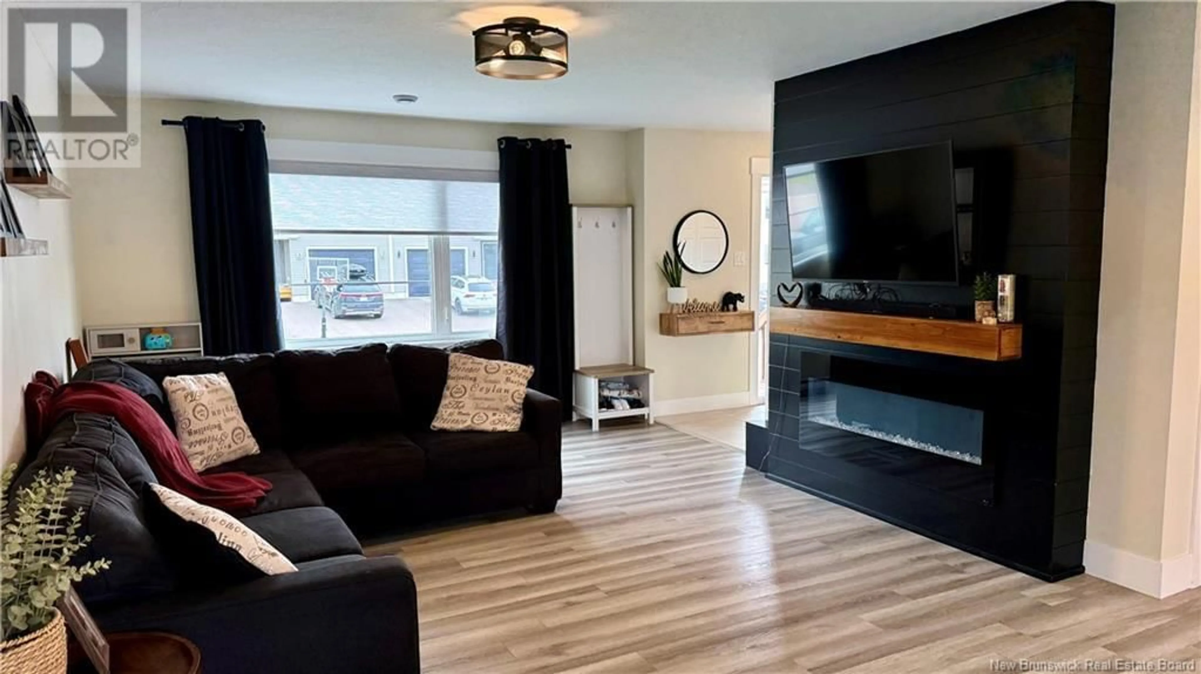 Living room with furniture, wood/laminate floor for 148 RUE MELANIE STREET, Dieppe New Brunswick E1A6N4