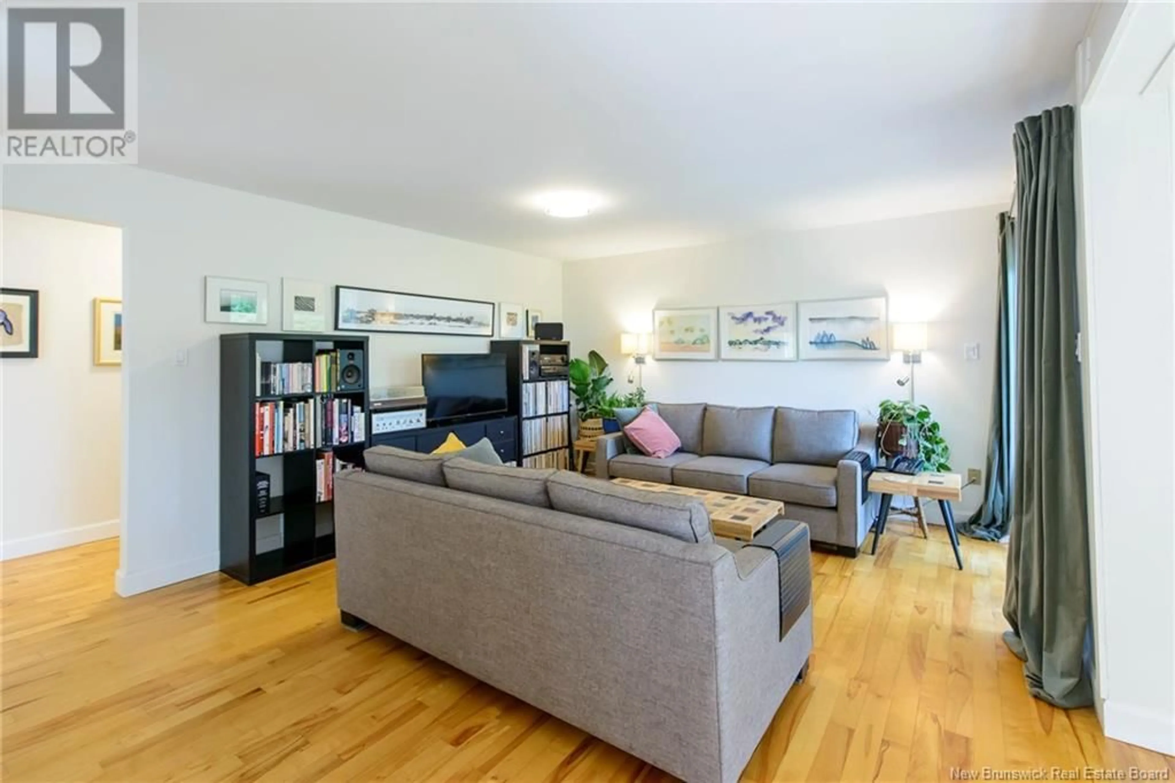 Living room with furniture, wood/laminate floor for 11 BELL AVENUE, Darlings Island New Brunswick E5N6R5