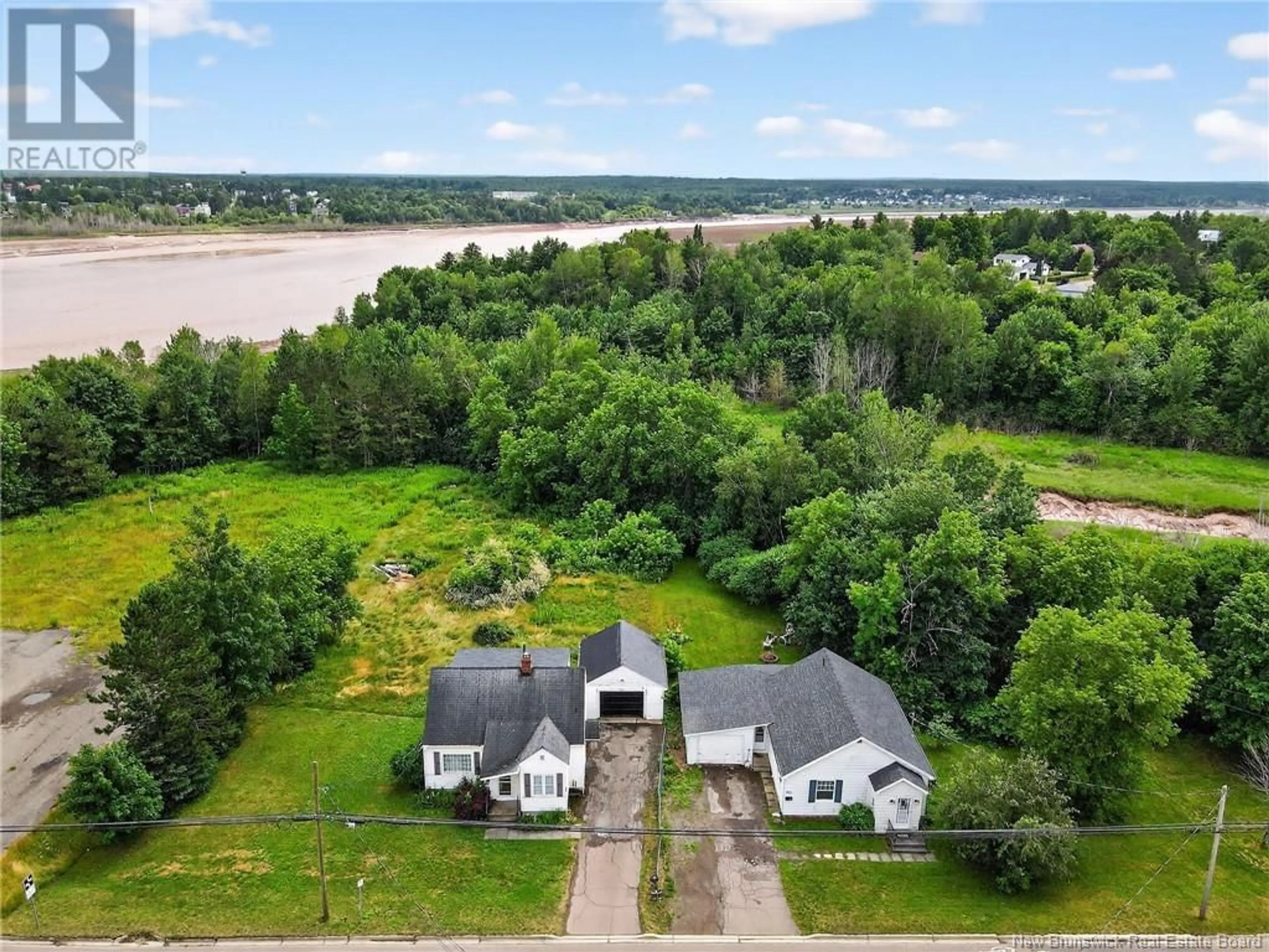 A pic from outside/outdoor area/front of a property/back of a property/a pic from drone, water/lake/river/ocean view for 300 SALISBURY ROAD, Moncton New Brunswick E1E1A7