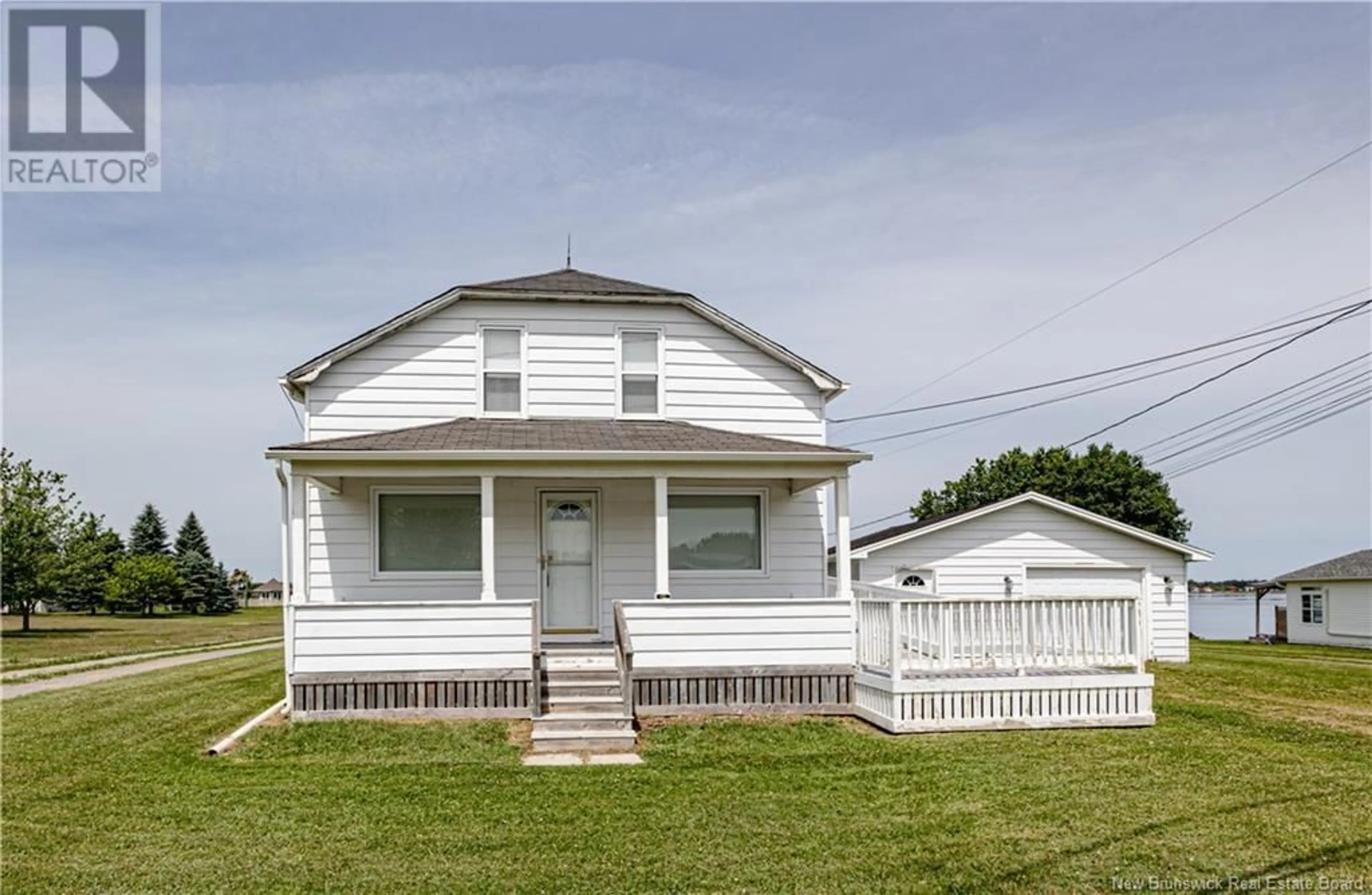 Home with vinyl exterior material, street for 10 RIVE SUD, Cocagne New Brunswick E4R2X1