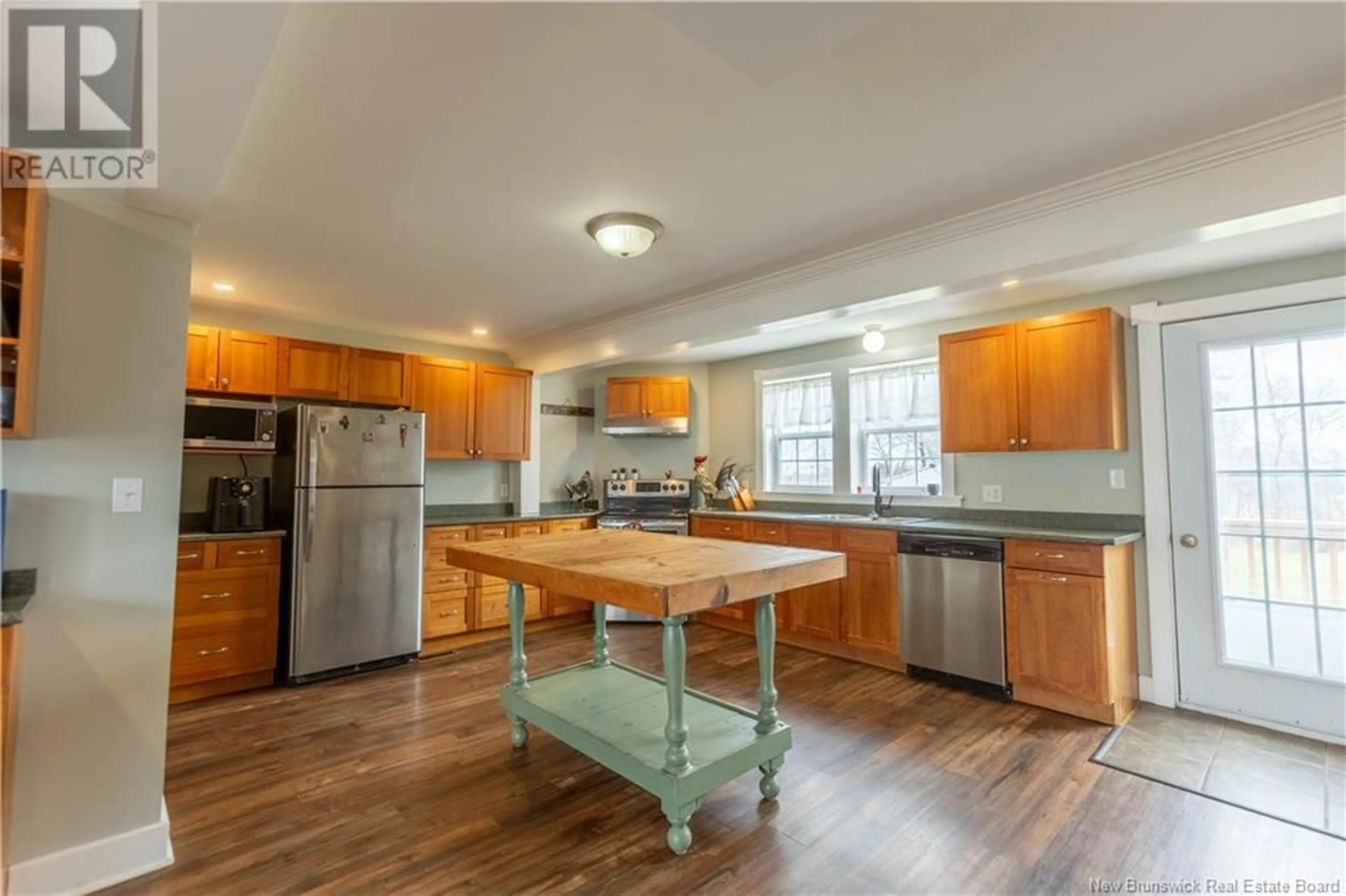 Open concept kitchen, wood/laminate floor for 11 SQUIRE STREET, Sackville New Brunswick E4L4K8