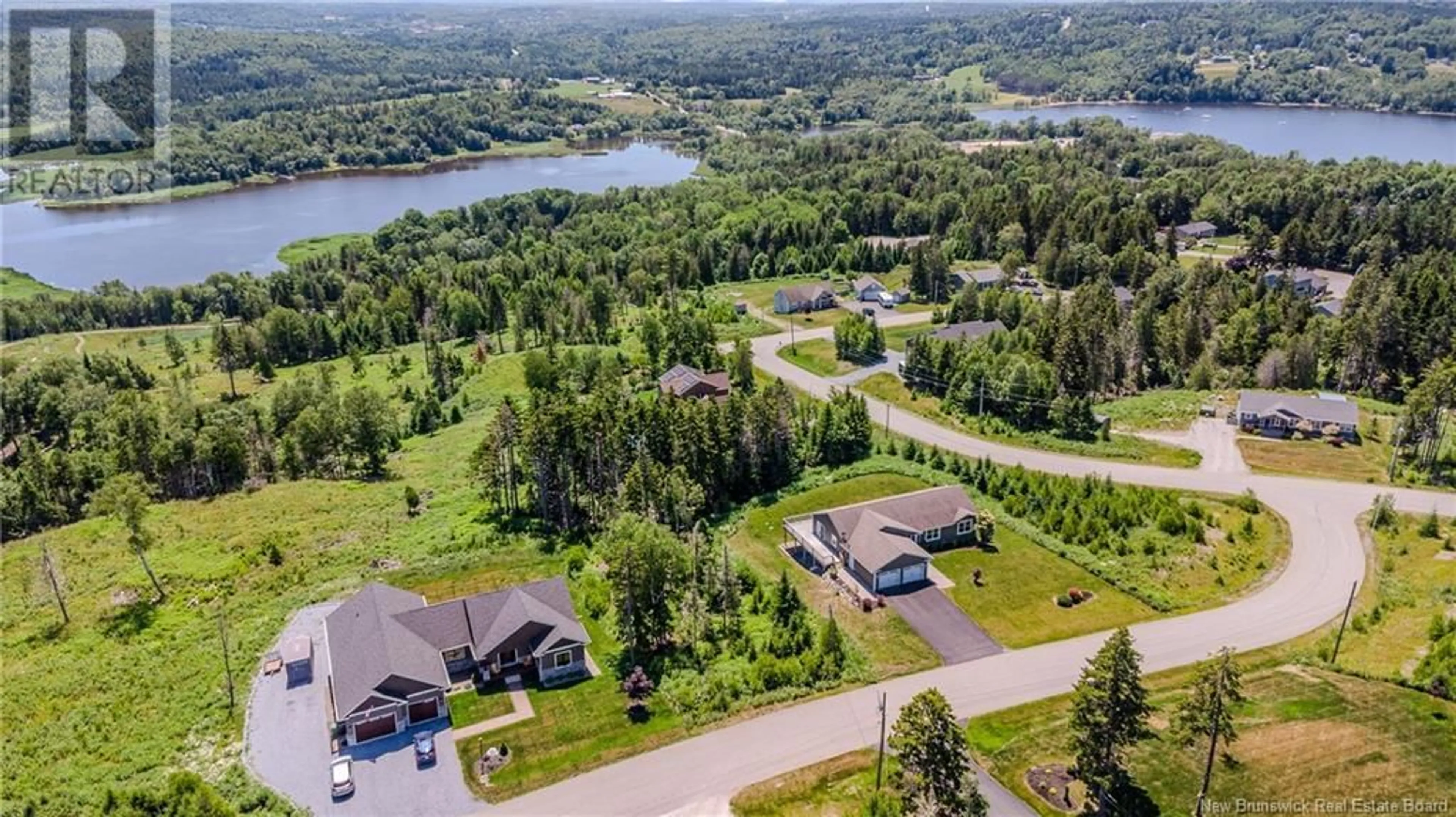 A pic from outside/outdoor area/front of a property/back of a property/a pic from drone, water/lake/river/ocean view for 4 SUMAC, Quispamsis New Brunswick E2G0H2