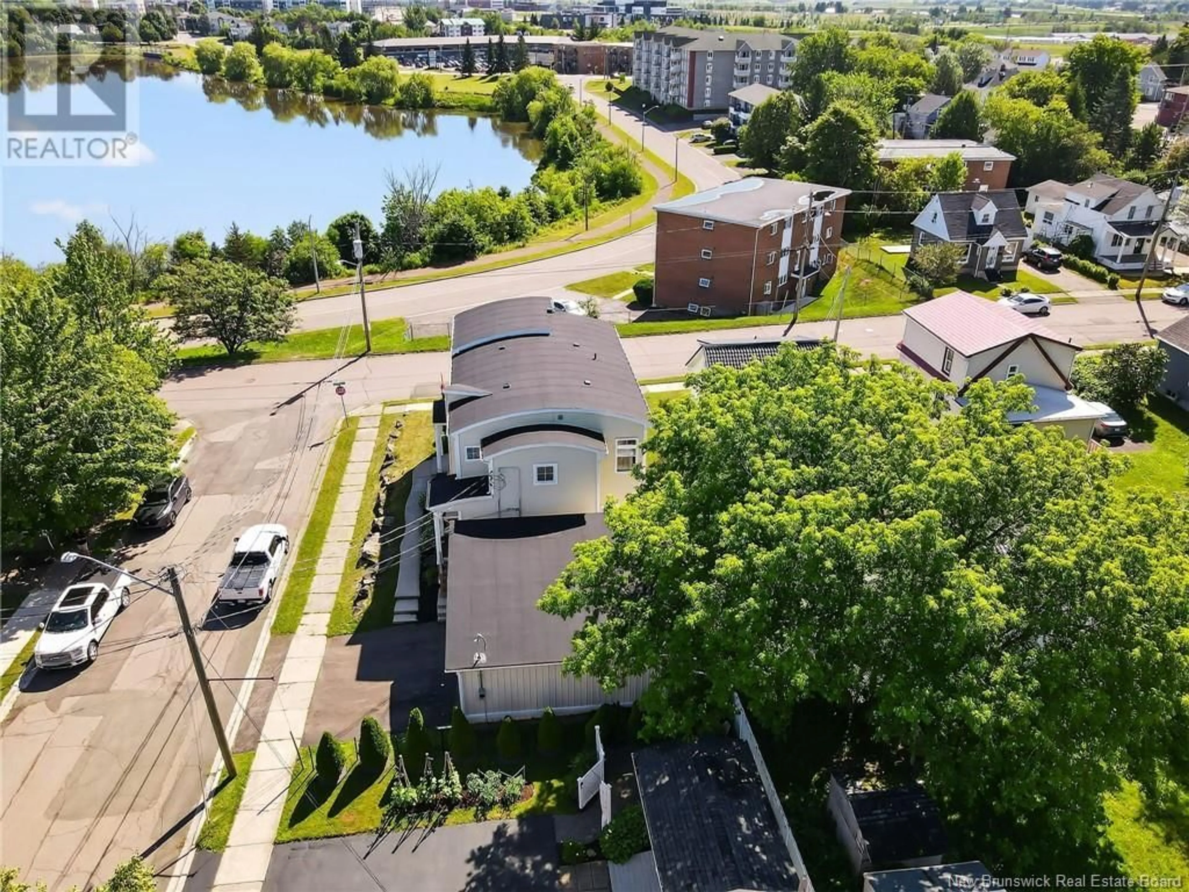 A pic from outside/outdoor area/front of a property/back of a property/a pic from drone, water/lake/river/ocean view for A - 94 NEWTON, Moncton New Brunswick E1E3A4