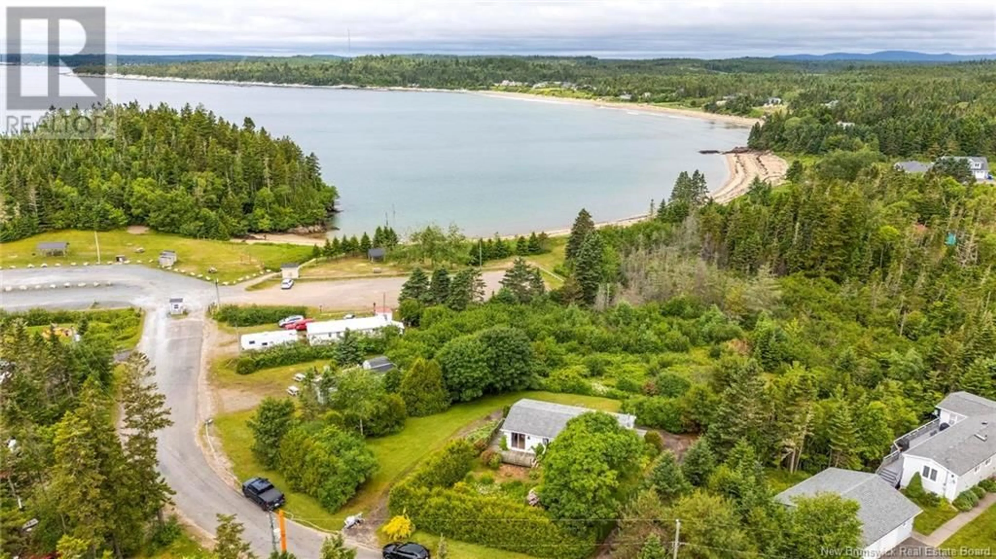 A pic from outside/outdoor area/front of a property/back of a property/a pic from drone, water/lake/river/ocean view for 22 CARRYING COVE, New River Beach New Brunswick E5J1J4