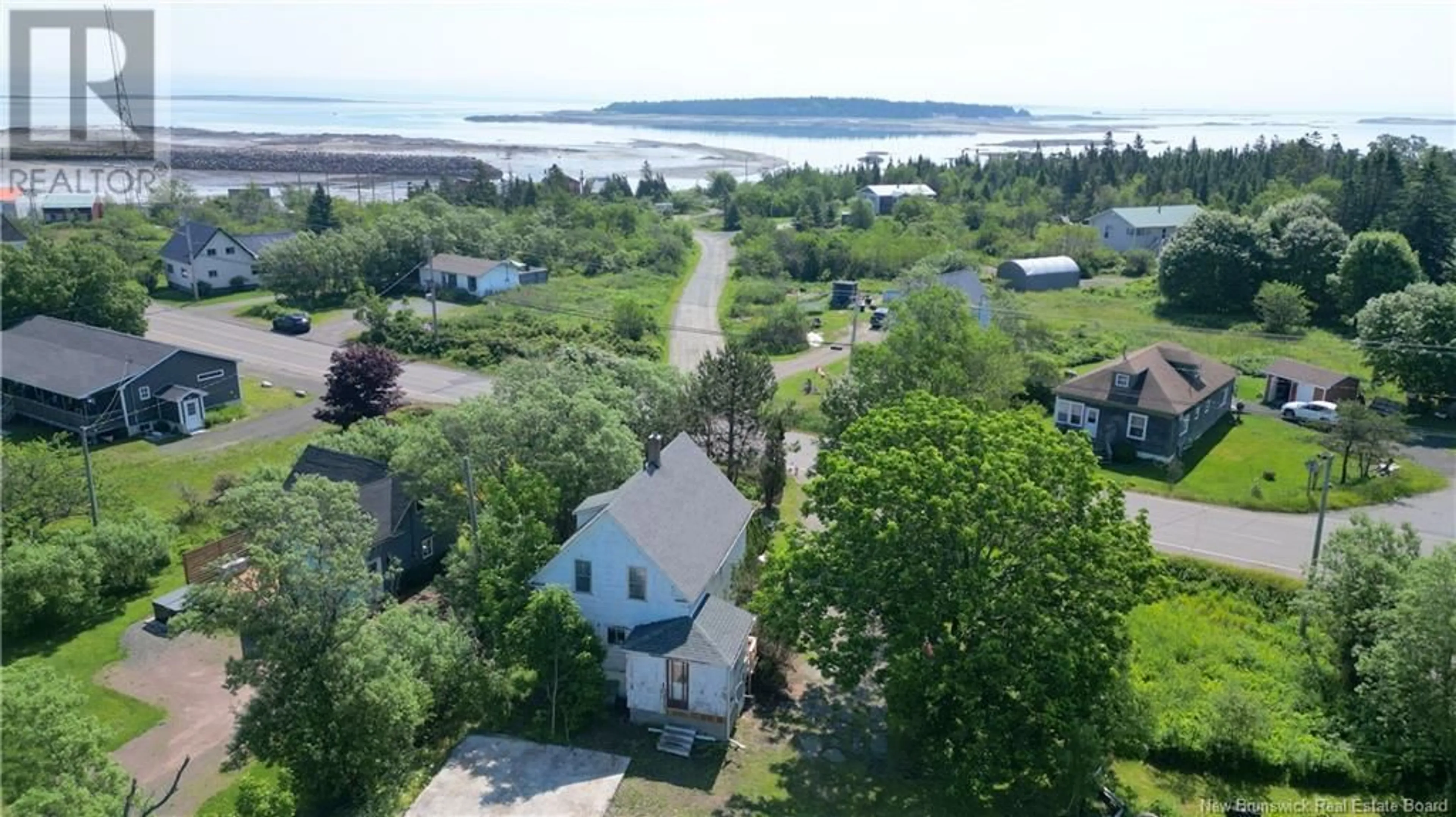 A pic from outside/outdoor area/front of a property/back of a property/a pic from drone, water/lake/river/ocean view for 912 ROUTE 776, Grand Manan New Brunswick E5G2E4