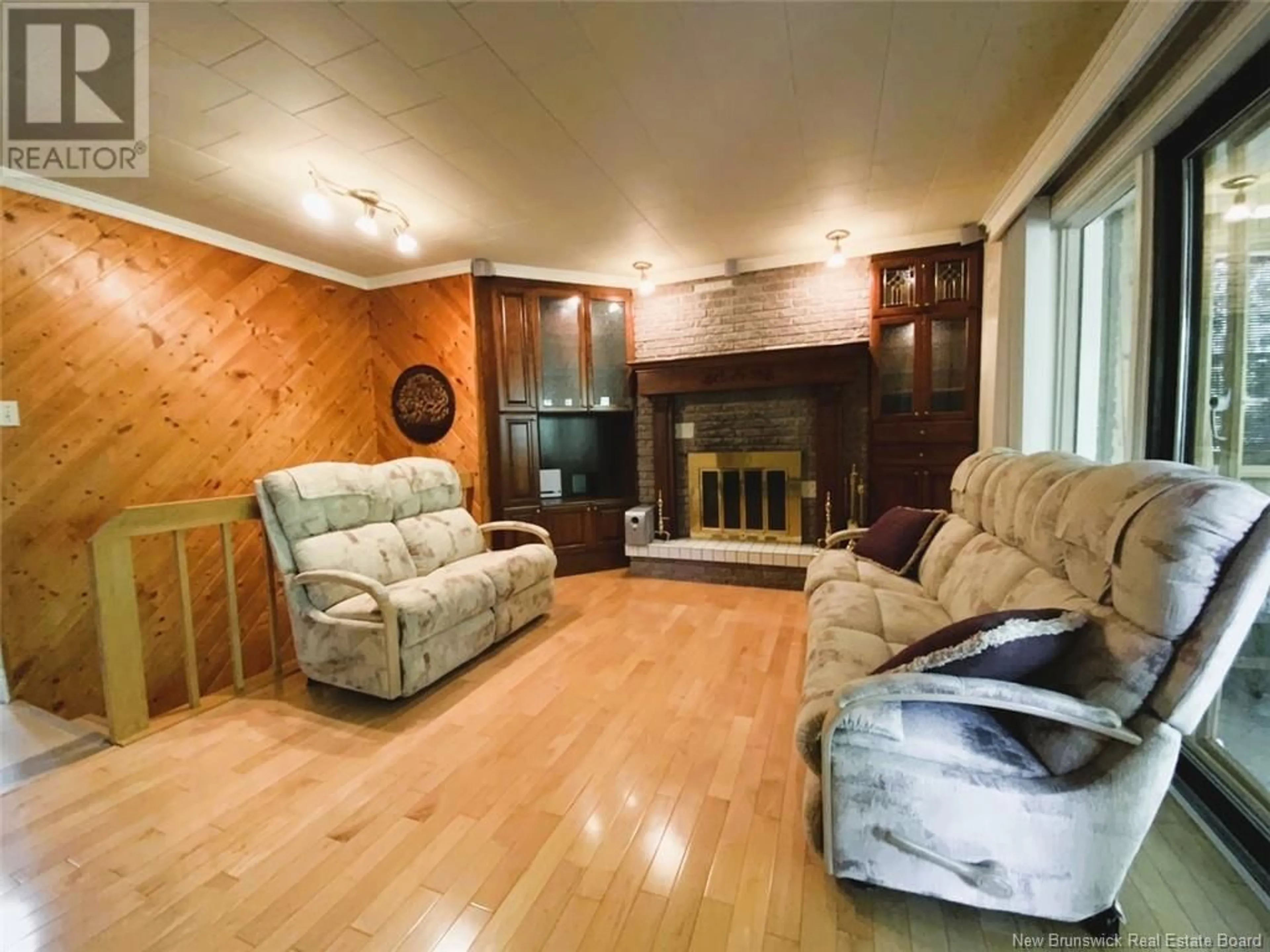 Living room with furniture, wood/laminate floor for 38 RUE ROAD, Saint-Basile New Brunswick E7C1V1