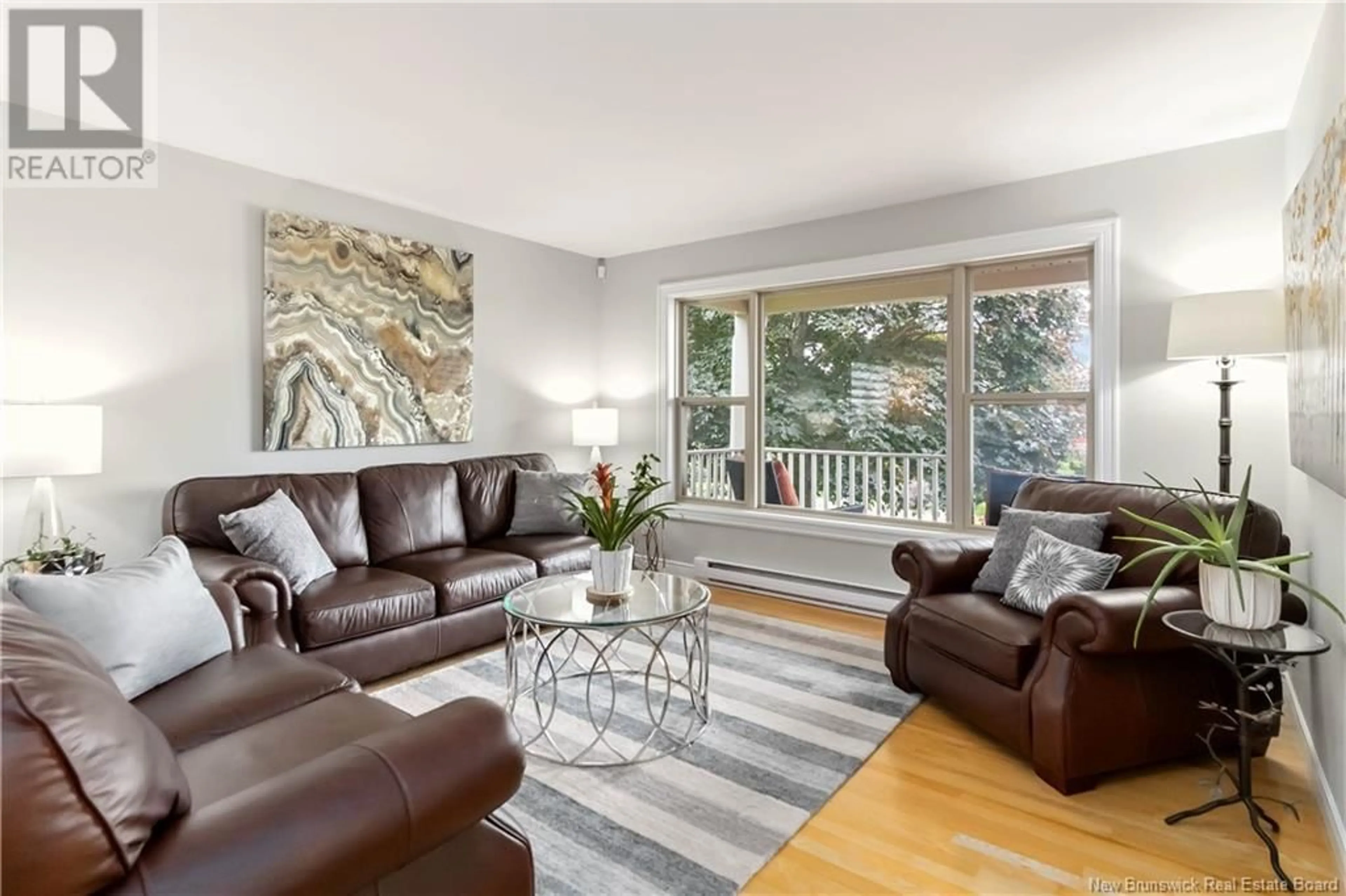 Living room with furniture, wood/laminate floor for 12 HARRIS DRIVE, Sackville New Brunswick E4L3X6