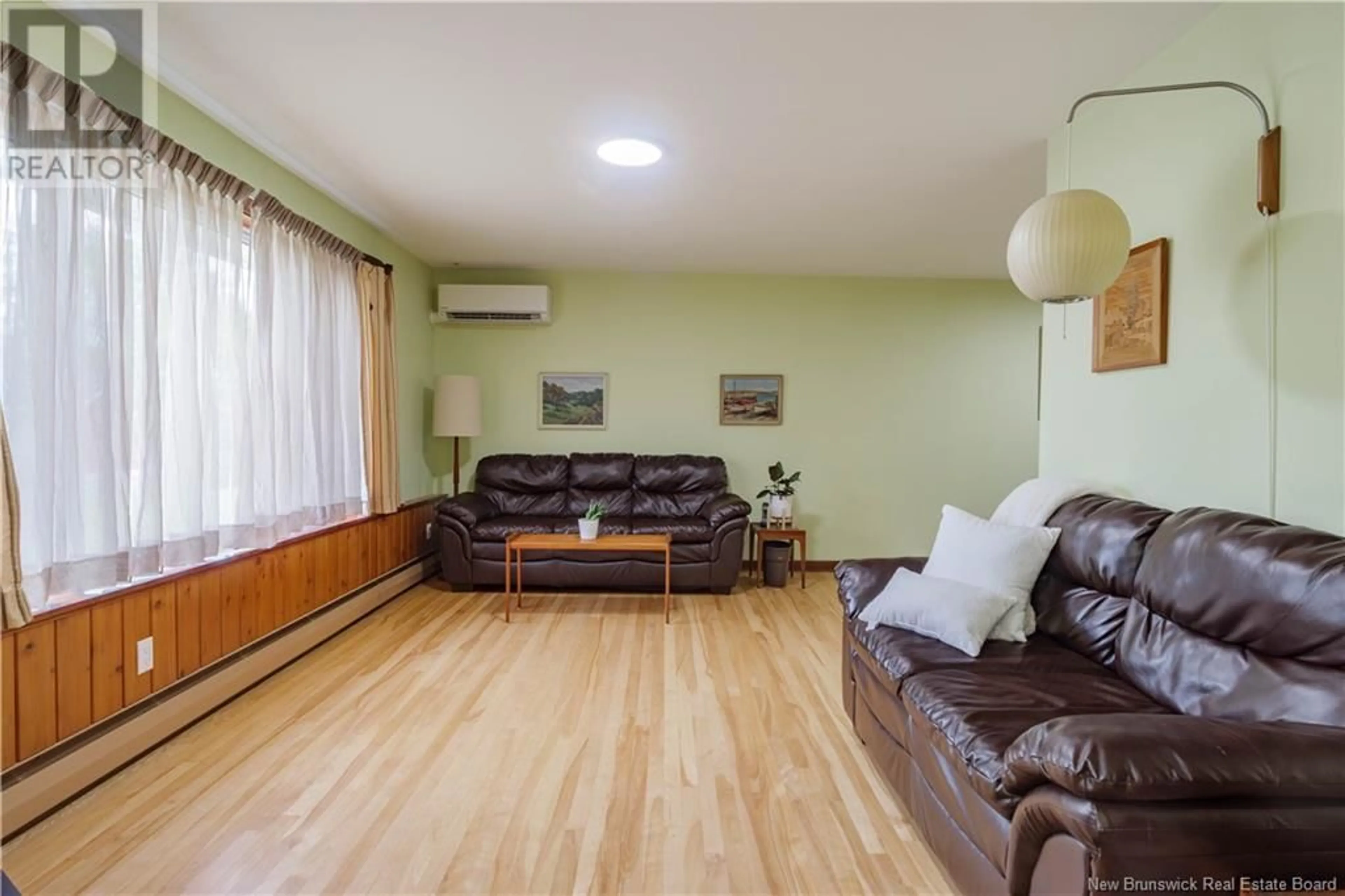 Living room with furniture, wood/laminate floor for 68 MANCHESTER COURT, Fredericton New Brunswick E3B4P2