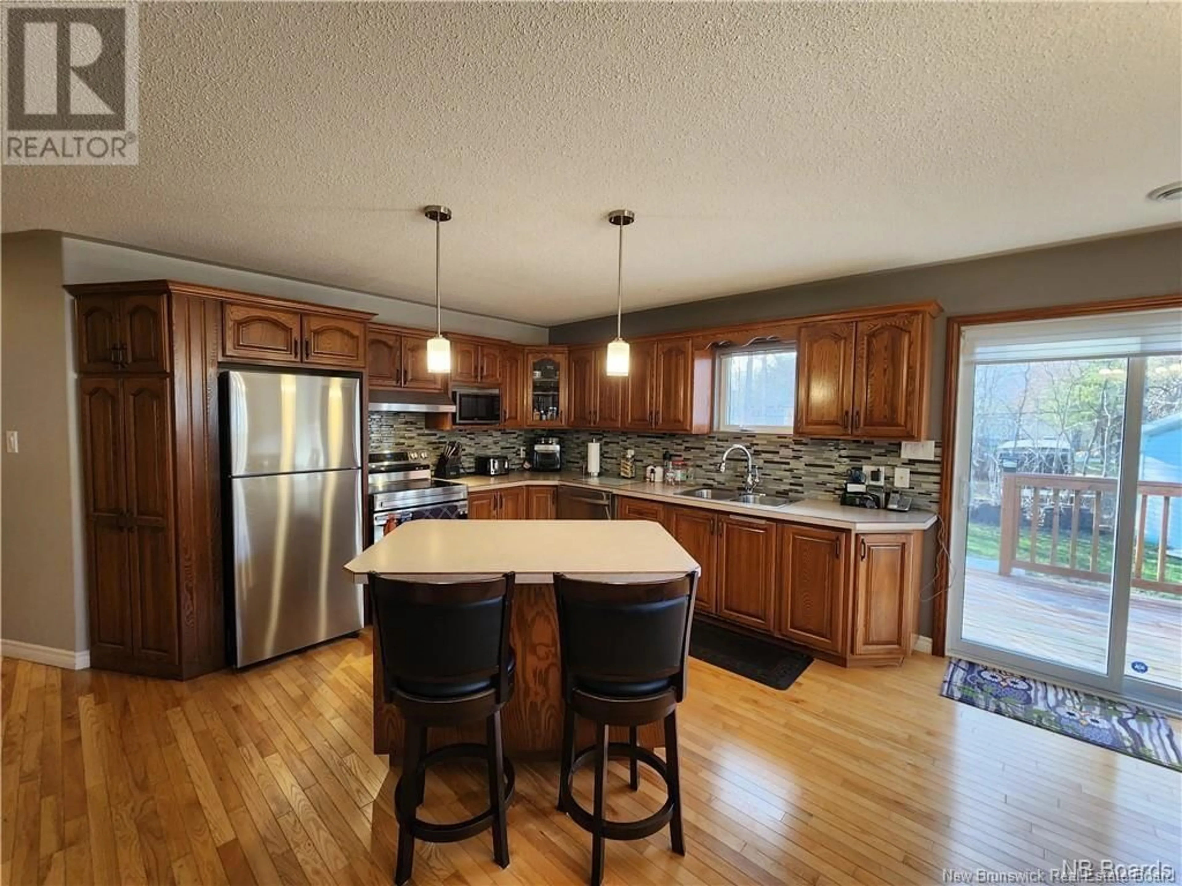 Open concept kitchen, wood/laminate floor for 229 JACQUELINE DRIVE, Miramichi New Brunswick E1N3Z2