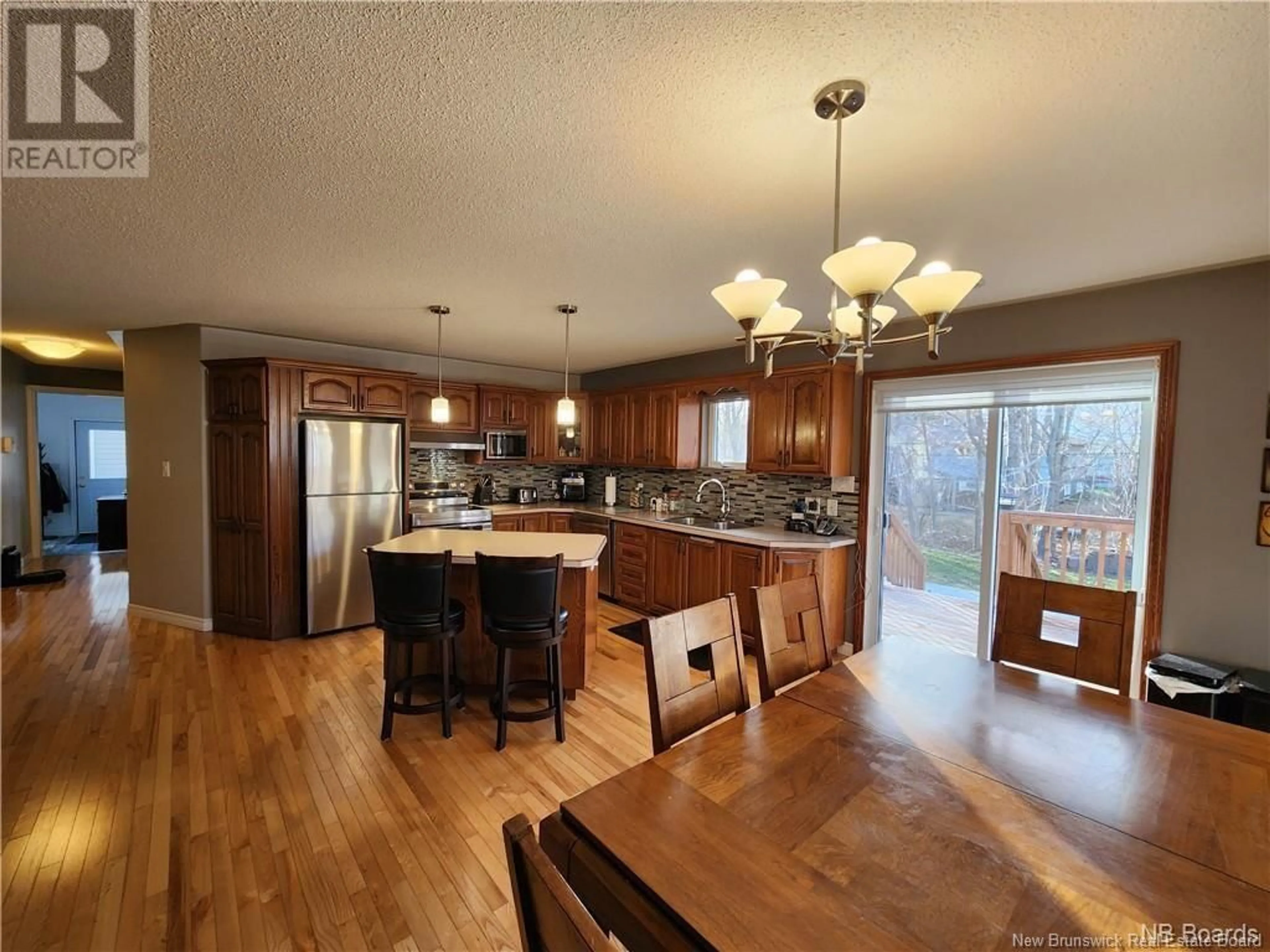 Open concept kitchen, wood/laminate floor for 229 JACQUELINE DRIVE, Miramichi New Brunswick E1N3Z2