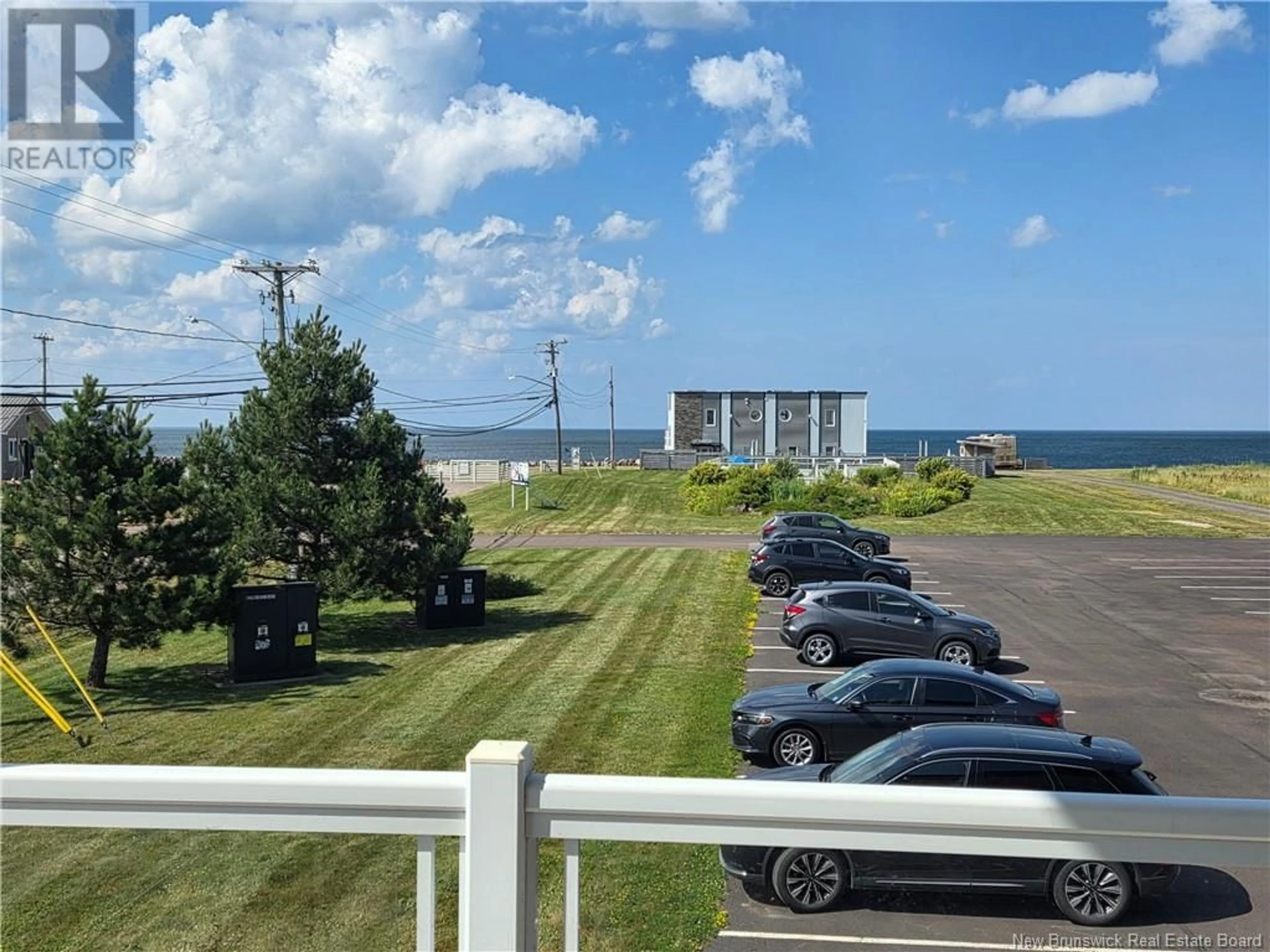 A pic from outside/outdoor area/front of a property/back of a property/a pic from drone, water/lake/river/ocean view for 215 - 69 CAP BIMET, Grand-Barachois New Brunswick E4P6X5