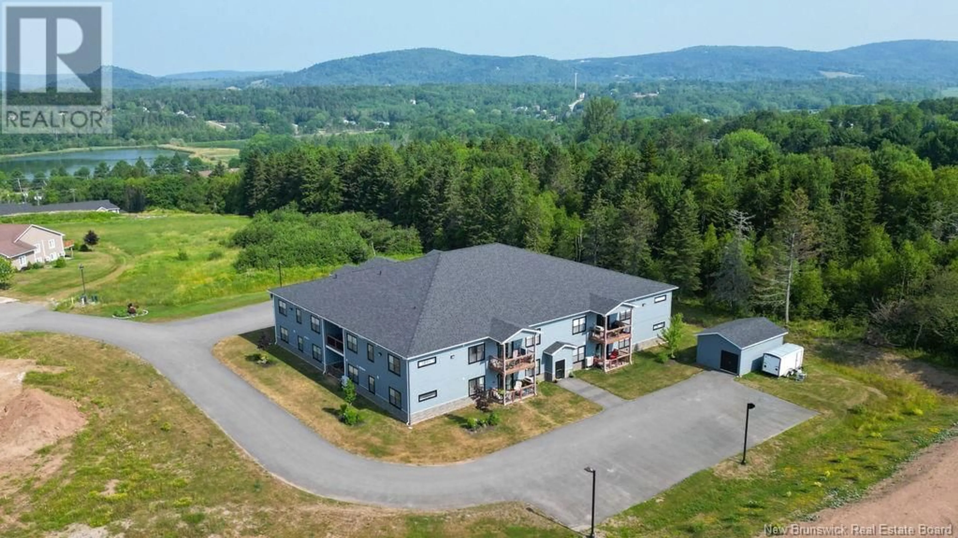 A pic from outside/outdoor area/front of a property/back of a property/a pic from drone, mountain view for 206 - 79 MAPLEVIEW, Hampton New Brunswick E5N0A6