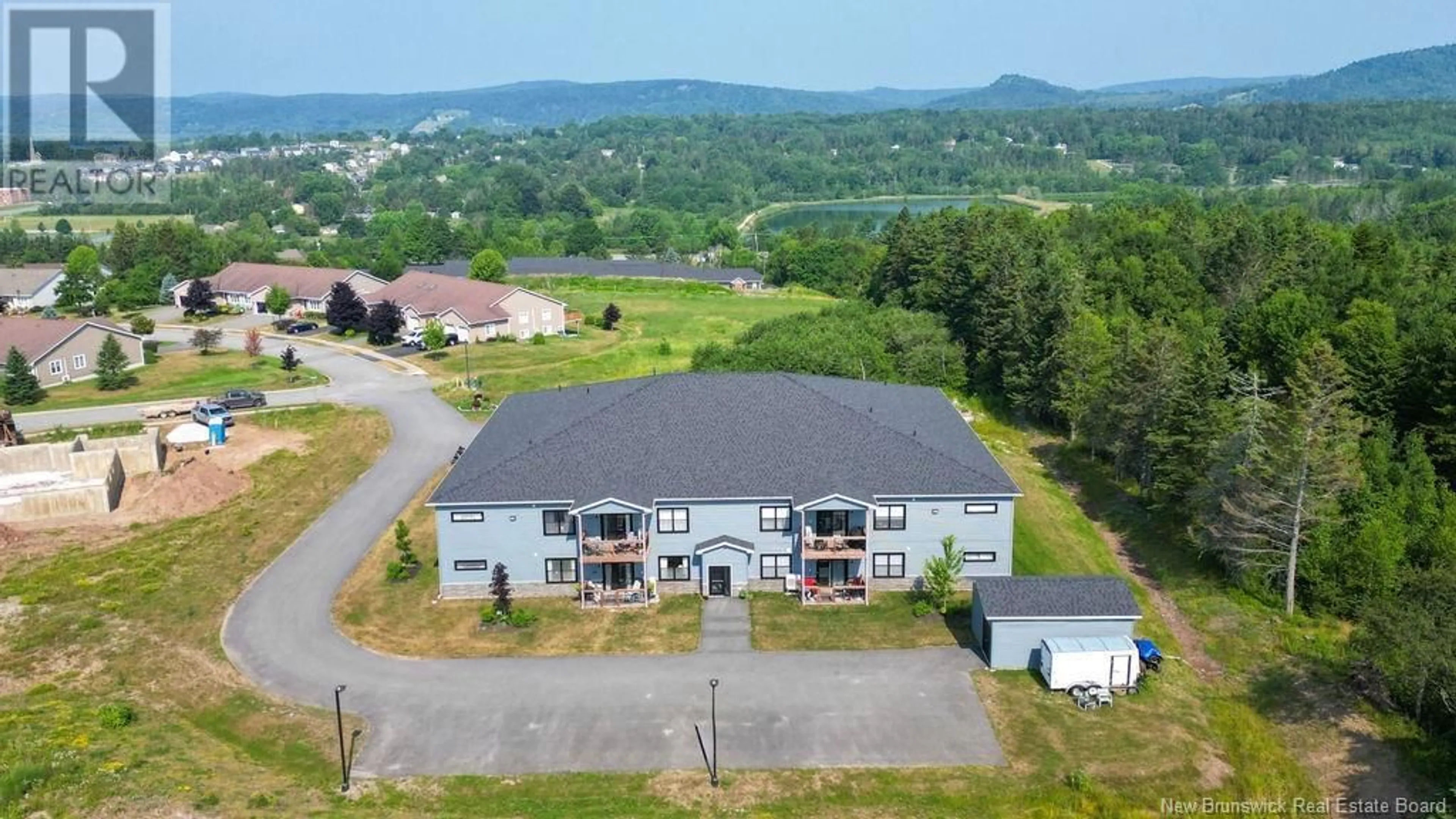 A pic from outside/outdoor area/front of a property/back of a property/a pic from drone, mountain view for 206 - 79 MAPLEVIEW, Hampton New Brunswick E5N0A6
