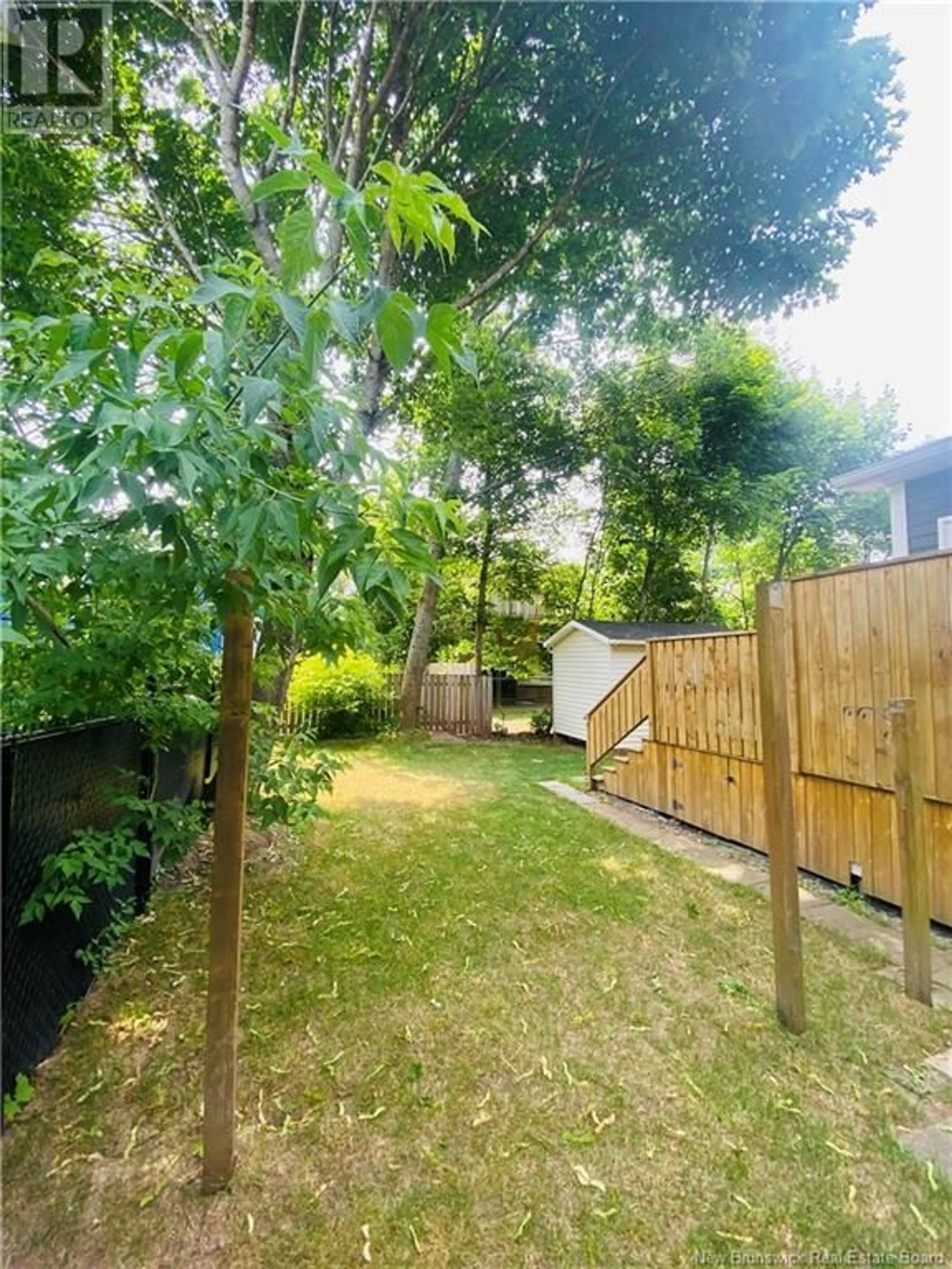 A pic from outside/outdoor area/front of a property/back of a property/a pic from drone, forest/trees view for 50 PRINCESS STREET, Moncton New Brunswick E1C2E5