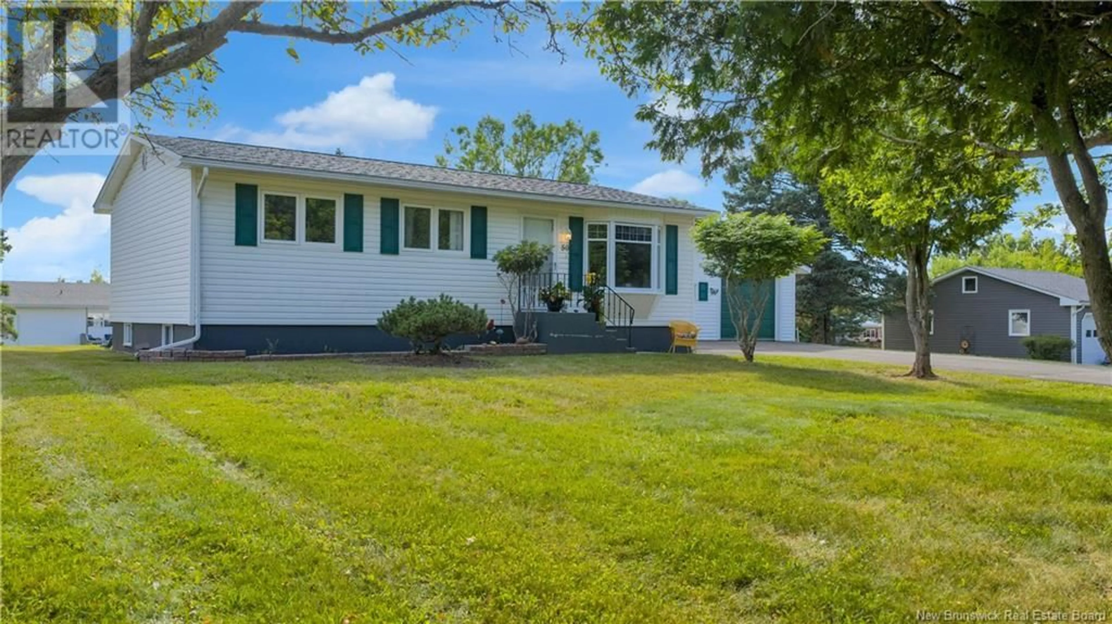 Home with vinyl exterior material, street for 50 COUGLE ROAD, Sussex Corner New Brunswick E4E2S6