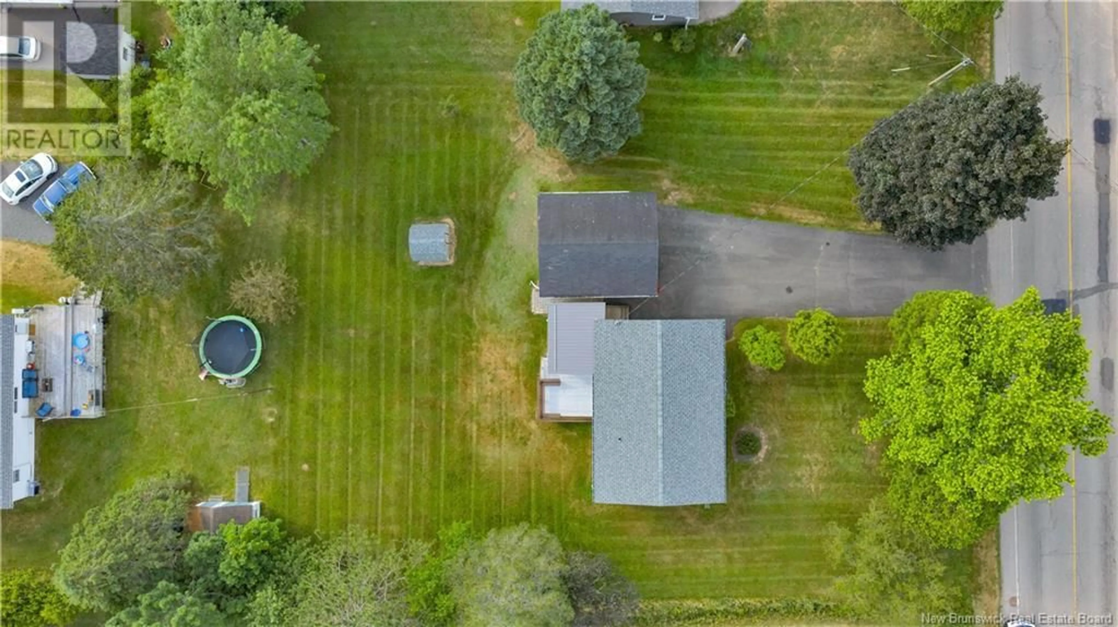 A pic from outside/outdoor area/front of a property/back of a property/a pic from drone, street for 50 COUGLE ROAD, Sussex Corner New Brunswick E4E2S6