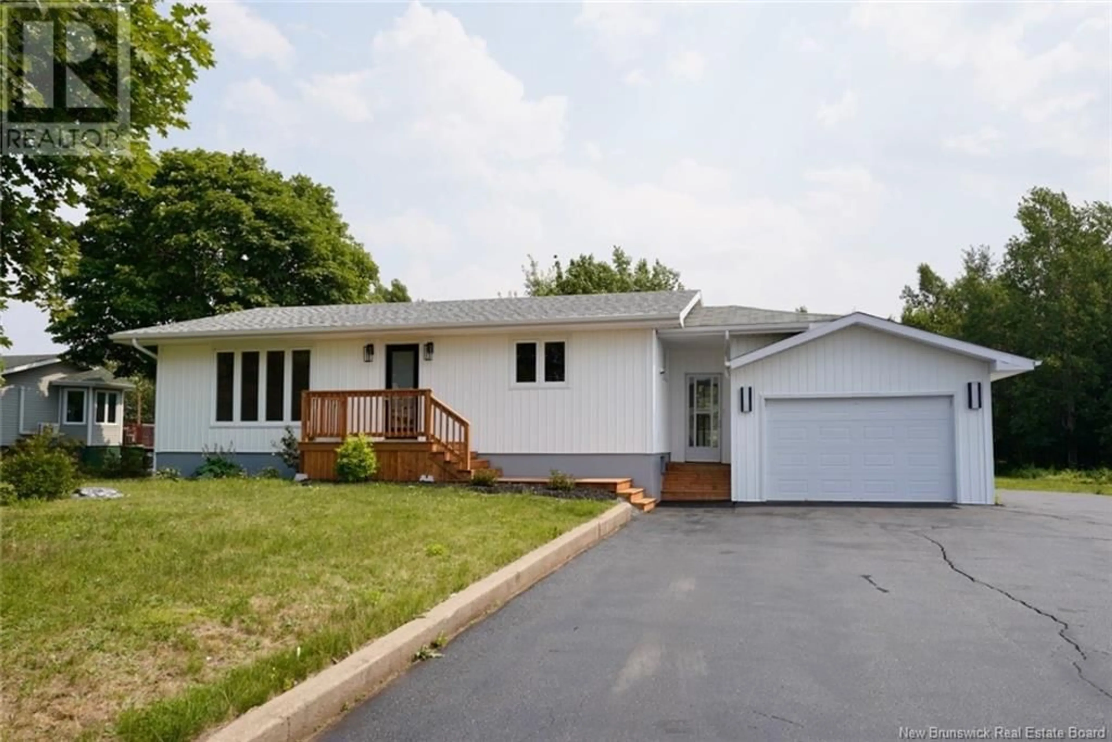 Home with vinyl exterior material, street for 221 RUE PARC, Beresford New Brunswick E8K1V9
