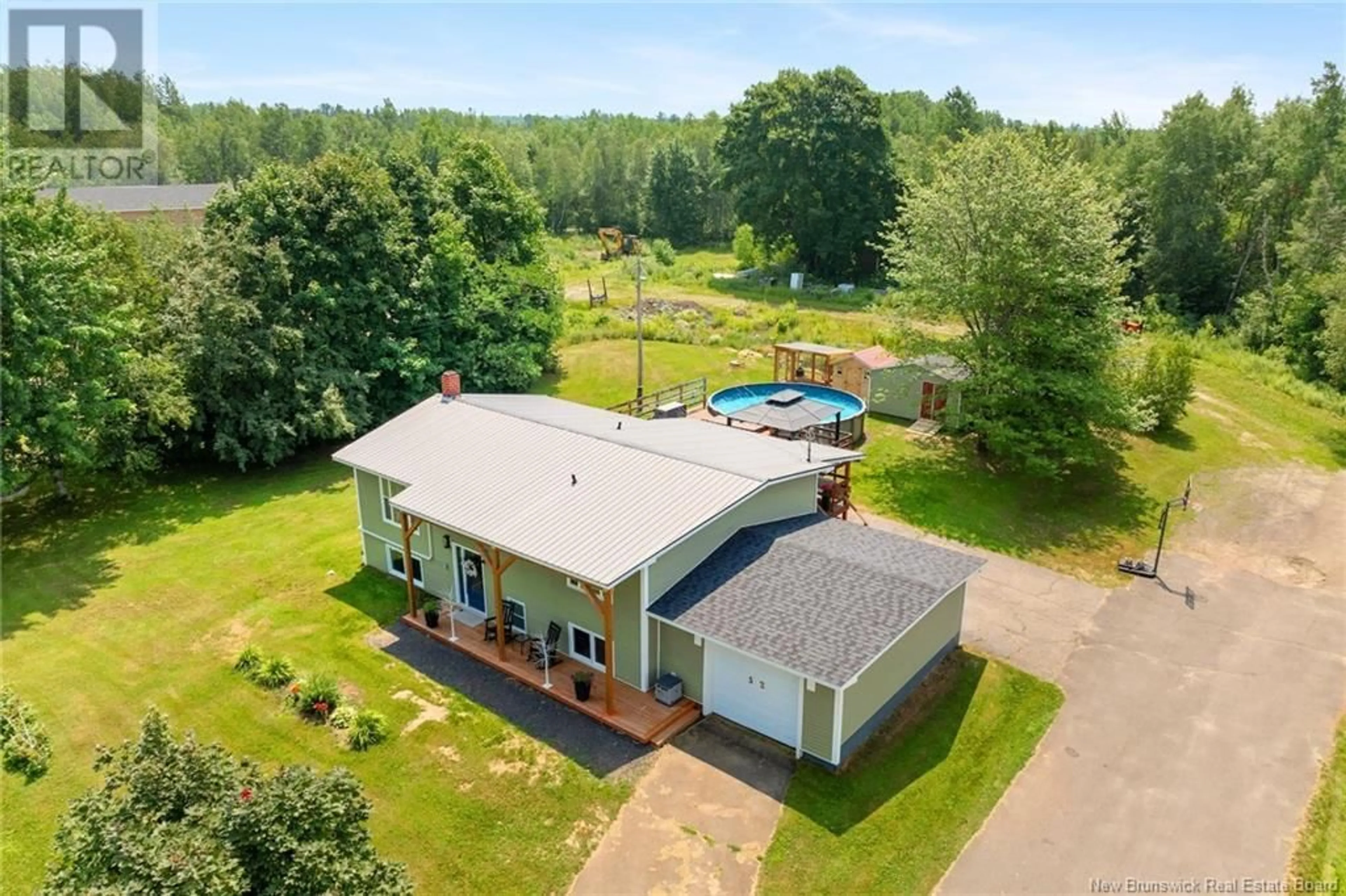 A pic from outside/outdoor area/front of a property/back of a property/a pic from drone, building for 52 KING STREET, Chipman New Brunswick E4A2H7