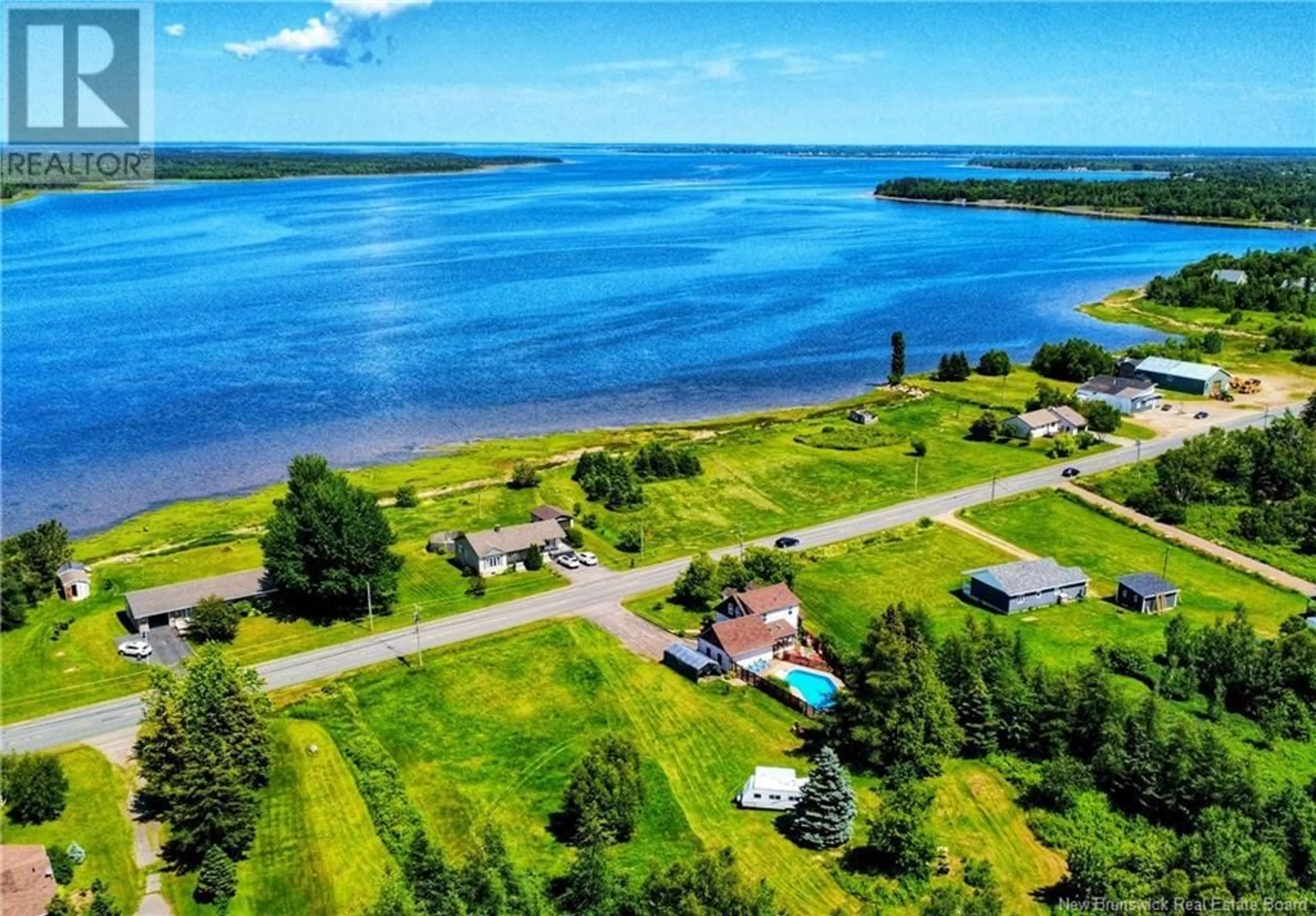 A pic from outside/outdoor area/front of a property/back of a property/a pic from drone, water/lake/river/ocean view for 1488 NB-335, Saint-Simon New Brunswick E8P2B3