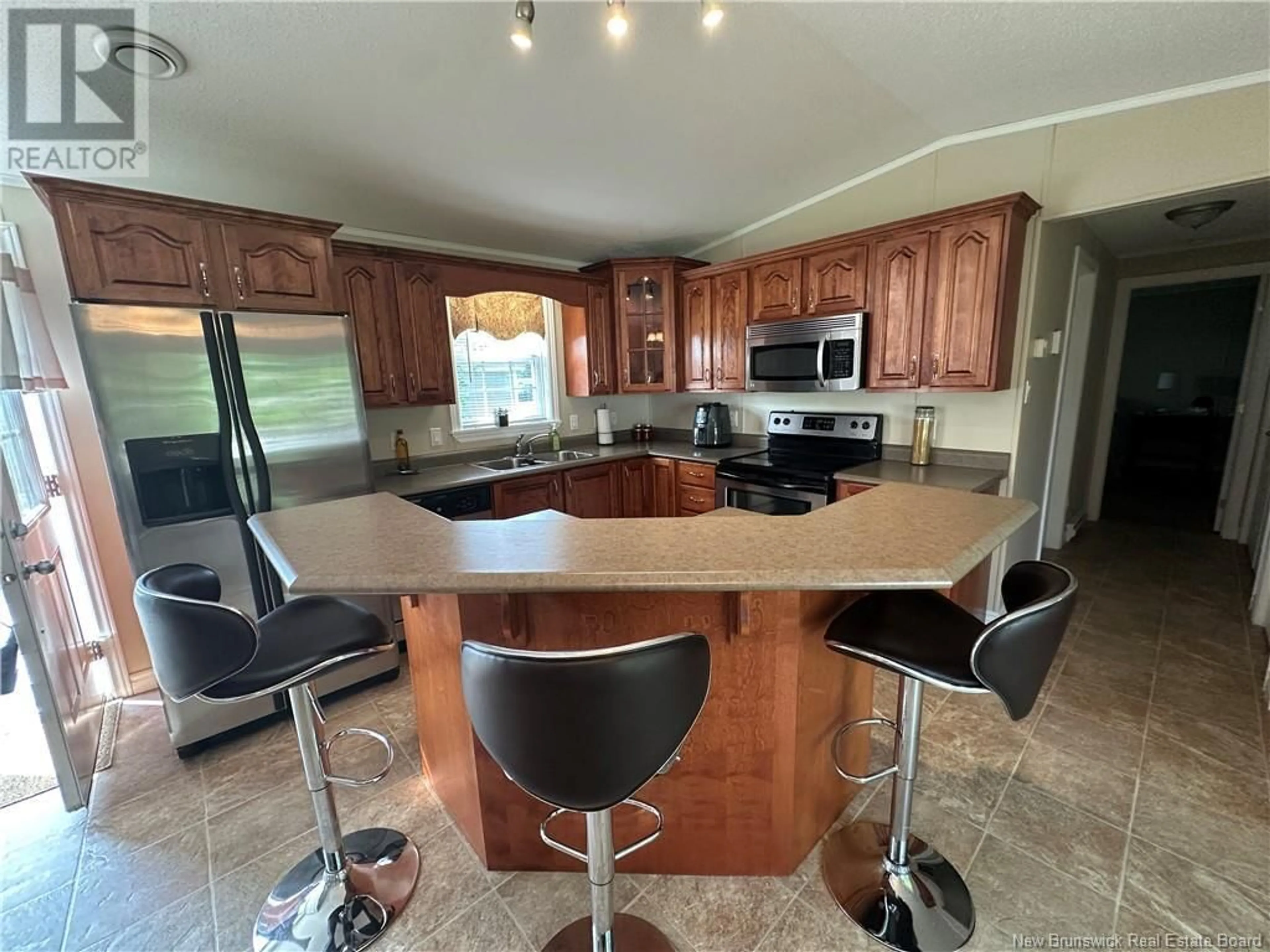 Open concept kitchen, ceramic/tile floor for 28 RENA STREET, Miramichi New Brunswick E1V0B8