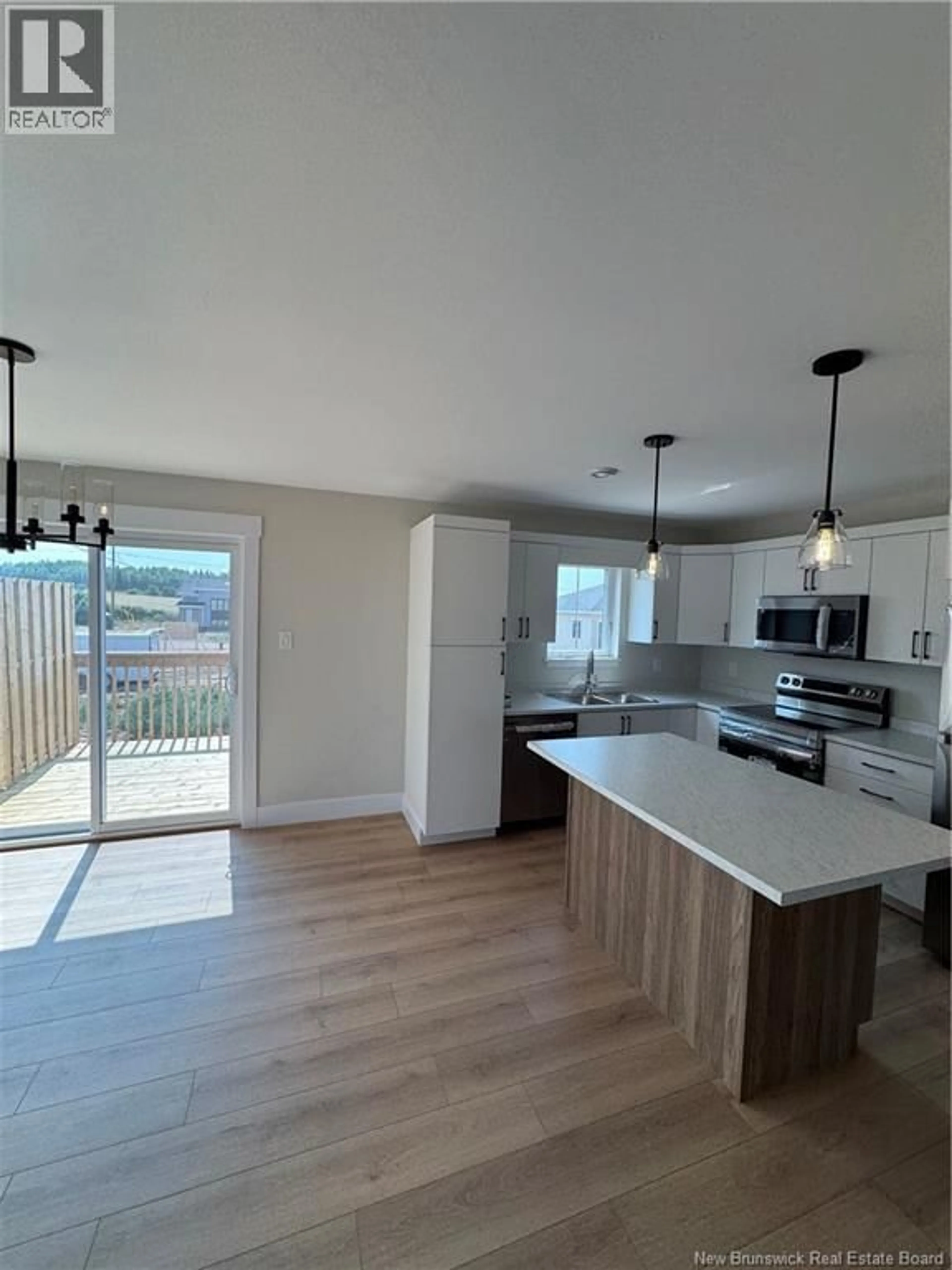 Open concept kitchen, wood/laminate floor for 273 MACCOUN STREET, Moncton New Brunswick E1K0A1