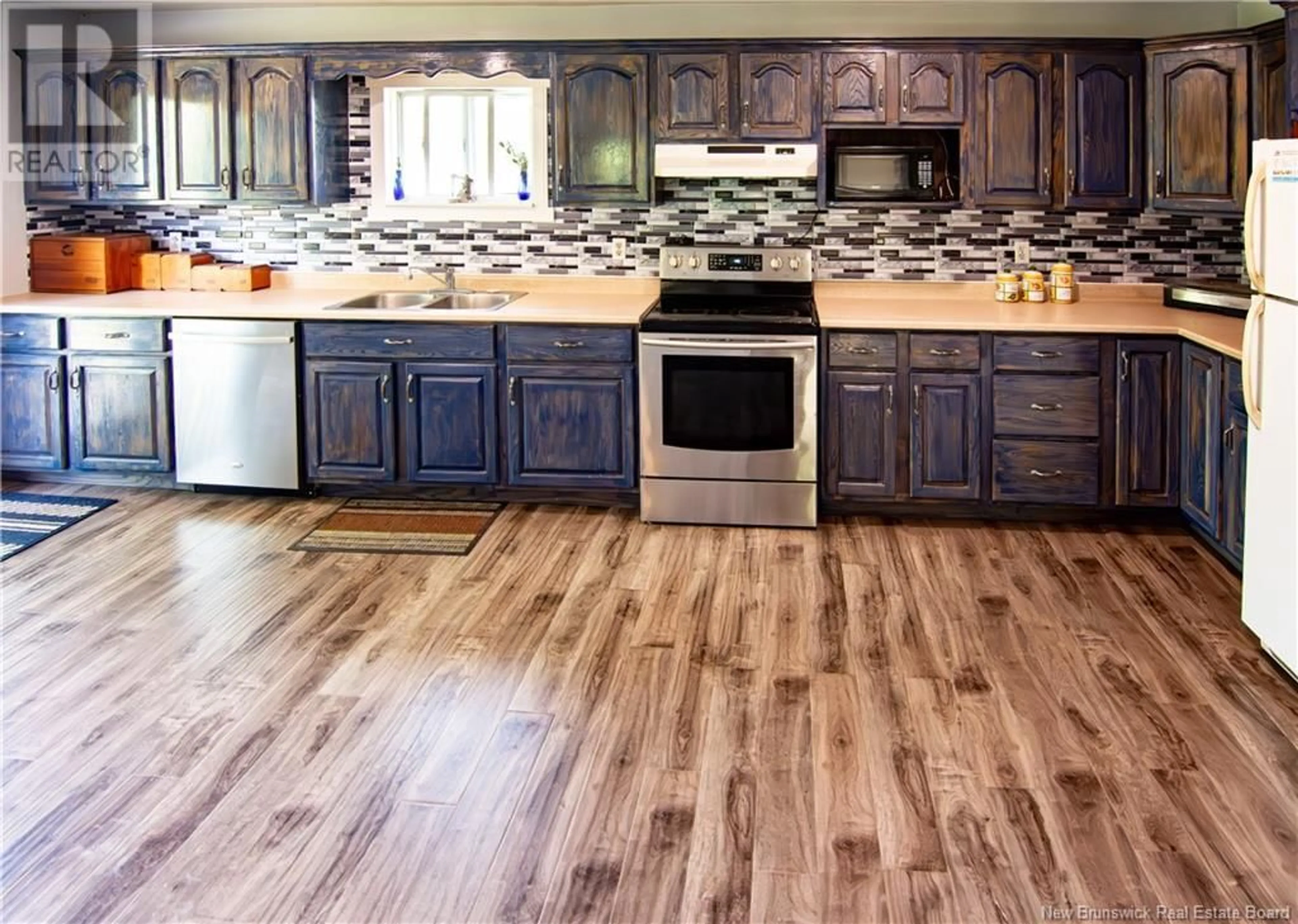 Open concept kitchen, wood/laminate floor for 47 SAINT DAMIEN ROAD, Saint-Antoine New Brunswick E4V3C1