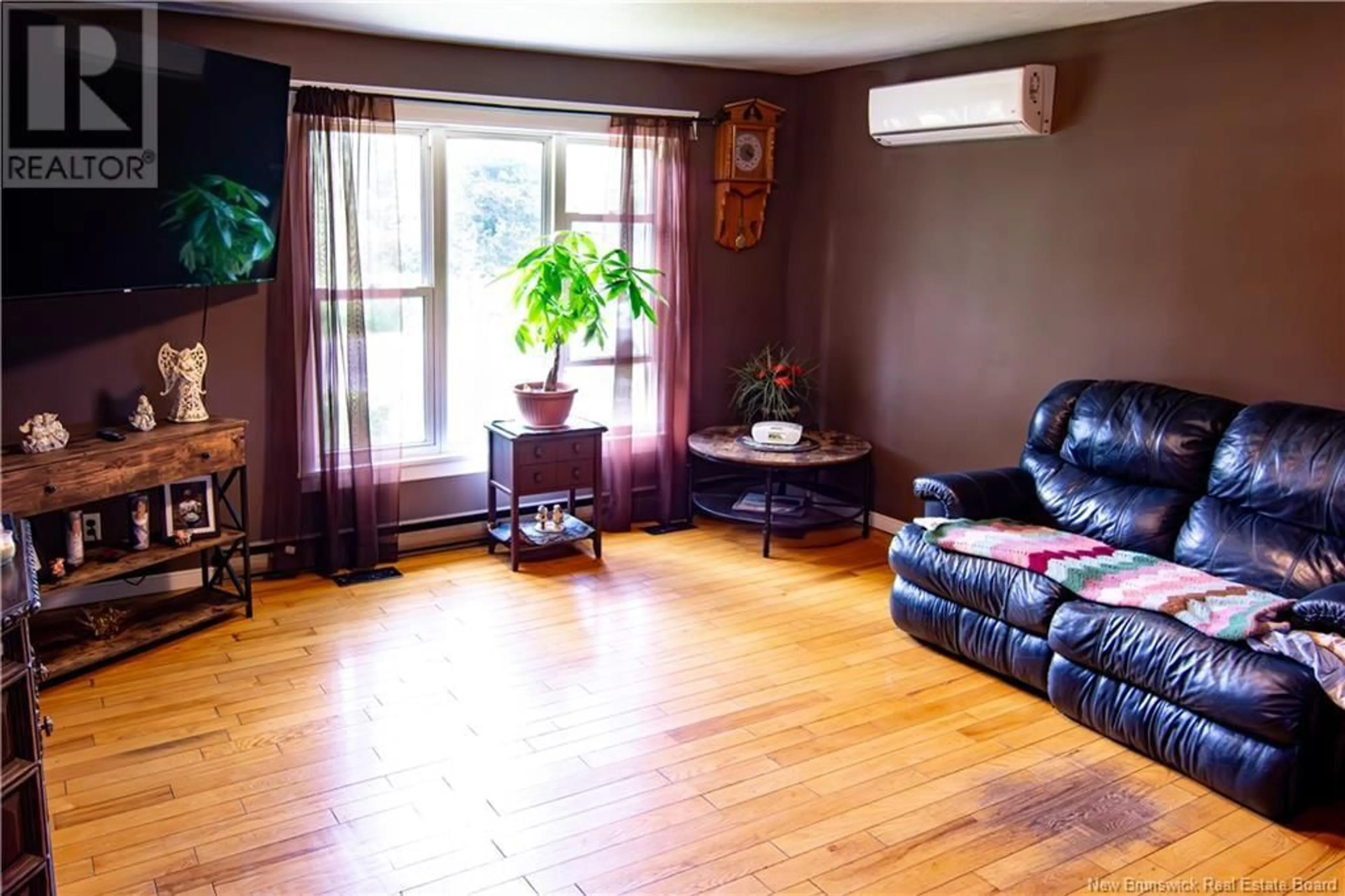 Living room with furniture, wood/laminate floor for 47 SAINT DAMIEN ROAD, Saint-Antoine New Brunswick E4V3C1