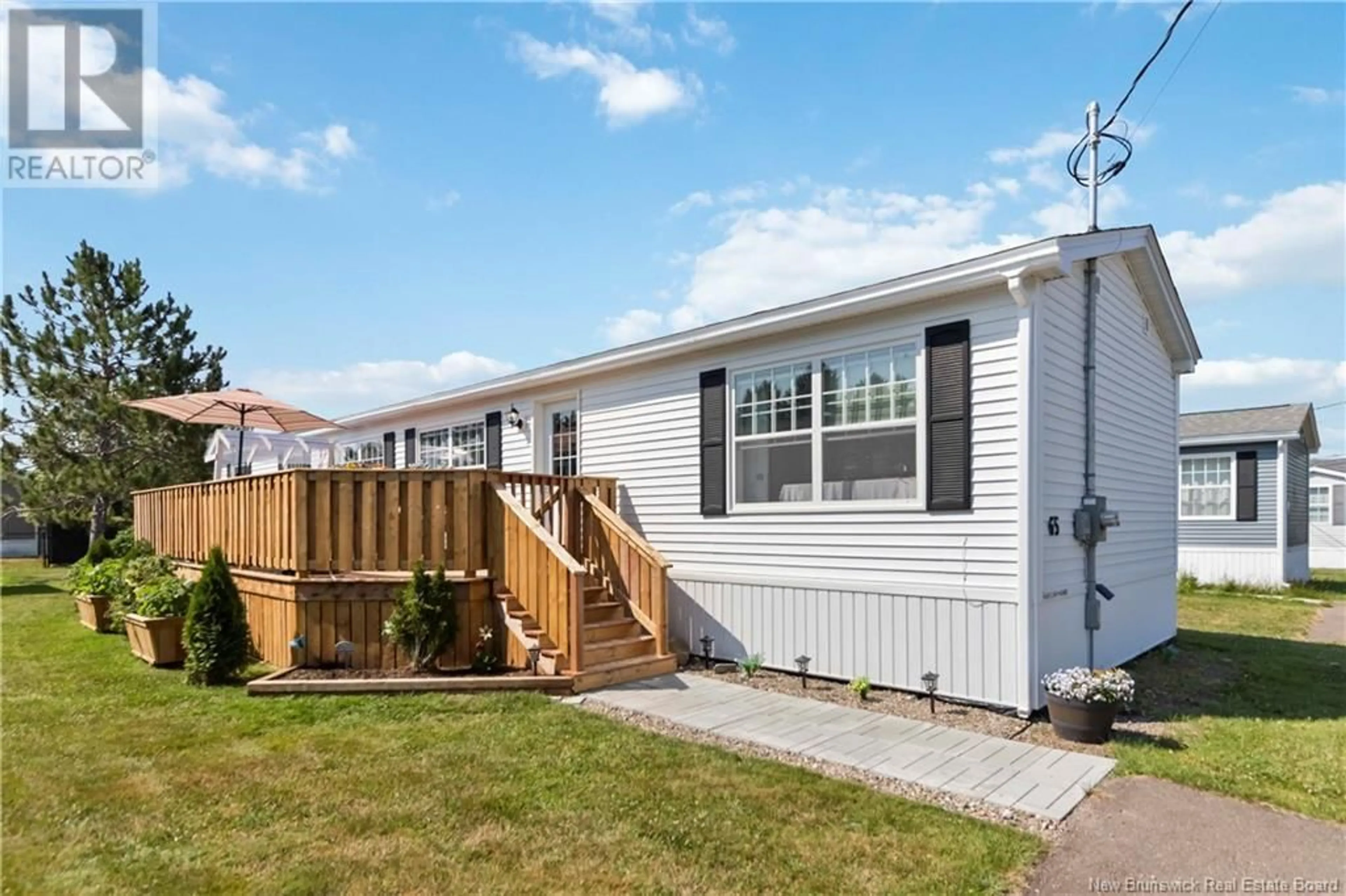 Home with vinyl exterior material, street for 65 ULYSSE DRIVE, Dieppe New Brunswick E1A7C2