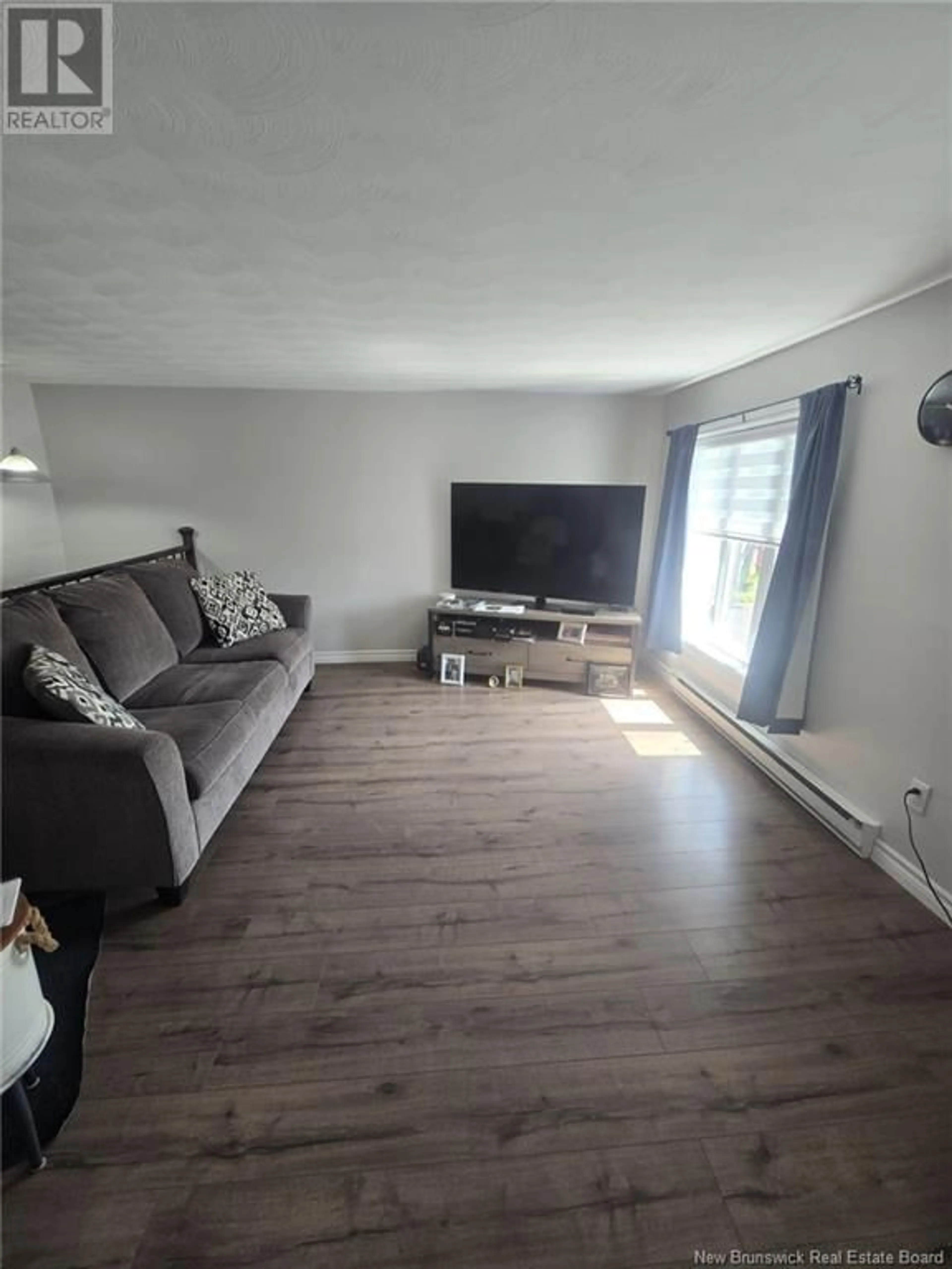Living room with furniture, wood/laminate floor for 42 HOTEL DE VILLE STREET, Clair New Brunswick E7A2E9