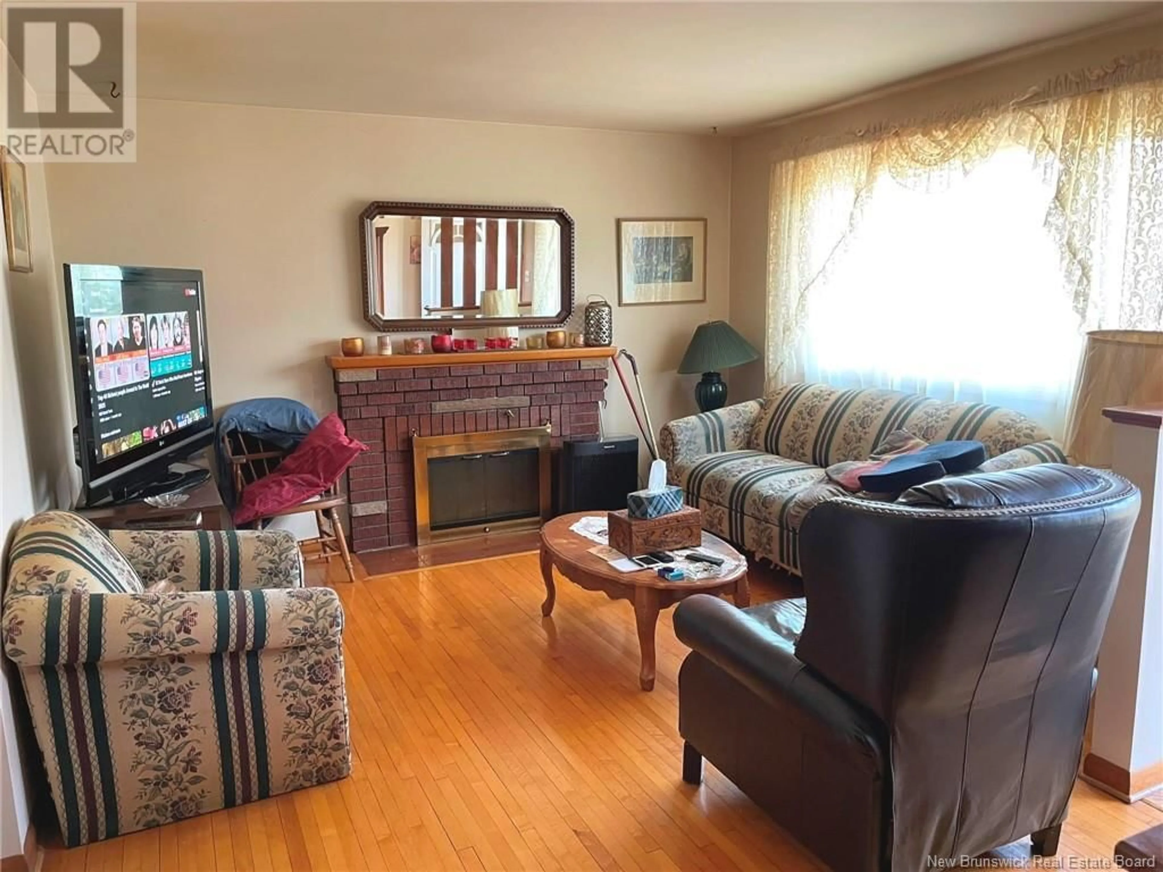 Living room with furniture, wood/laminate floor for 42 ATKINSON, Moncton New Brunswick E1C7S3