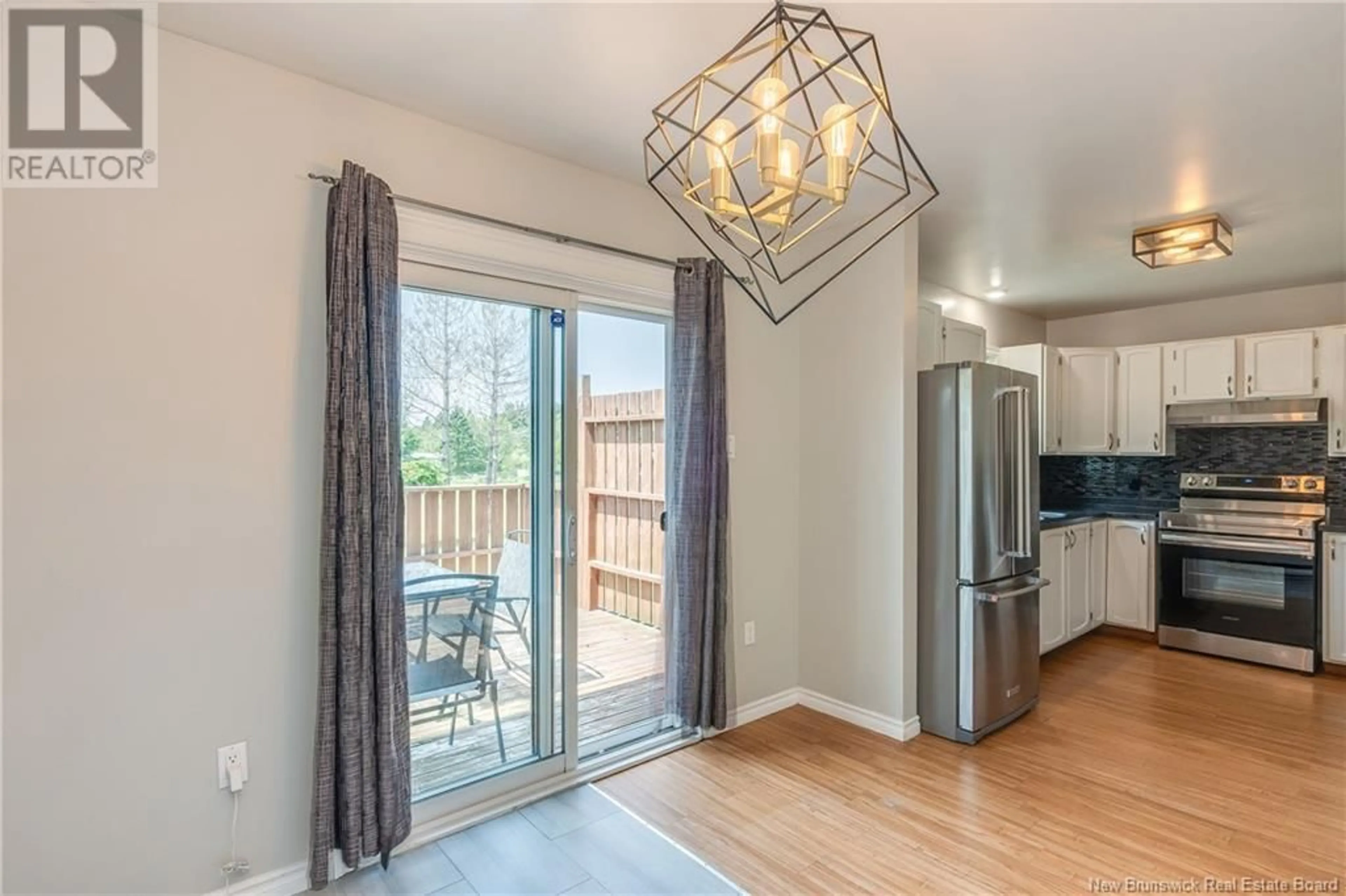 Open concept kitchen, wood/laminate floor for 21 DALILA COURT, Saint John New Brunswick E2H5P9
