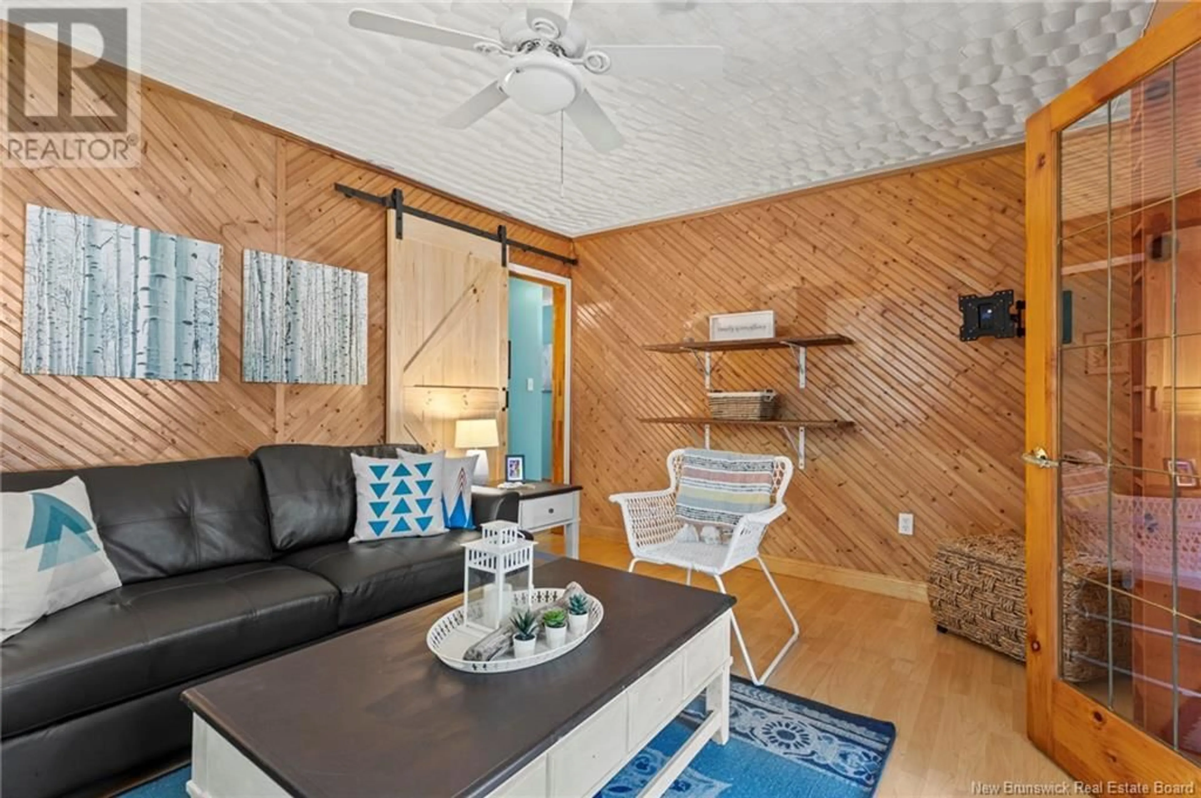 Living room with furniture, wood/laminate floor for 10 MARINE DRIVE, Cumberland Bay New Brunswick E4A3L9