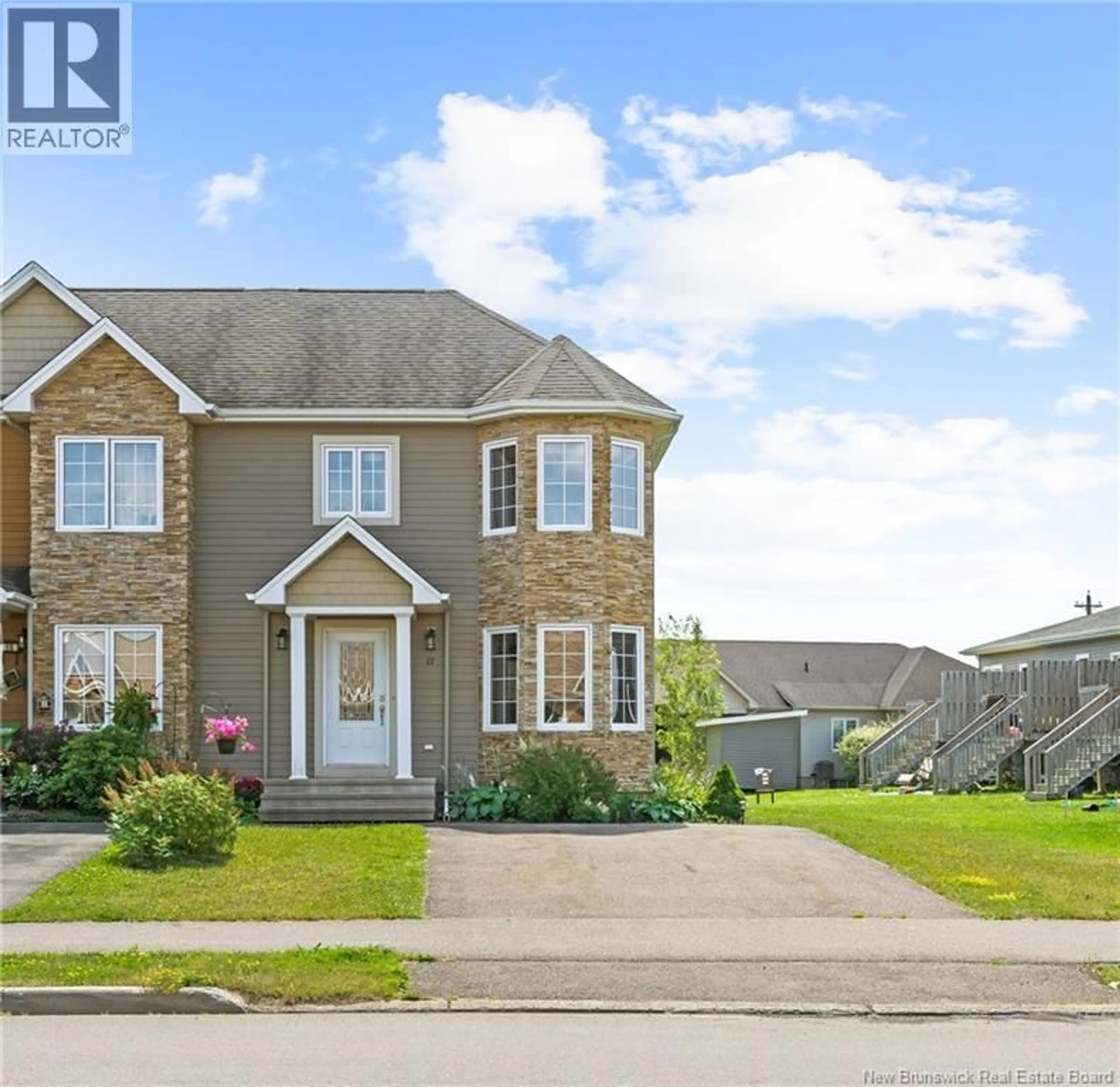 Home with vinyl exterior material, street for 67 LAKEBURN, Dieppe New Brunswick E1A0Y8