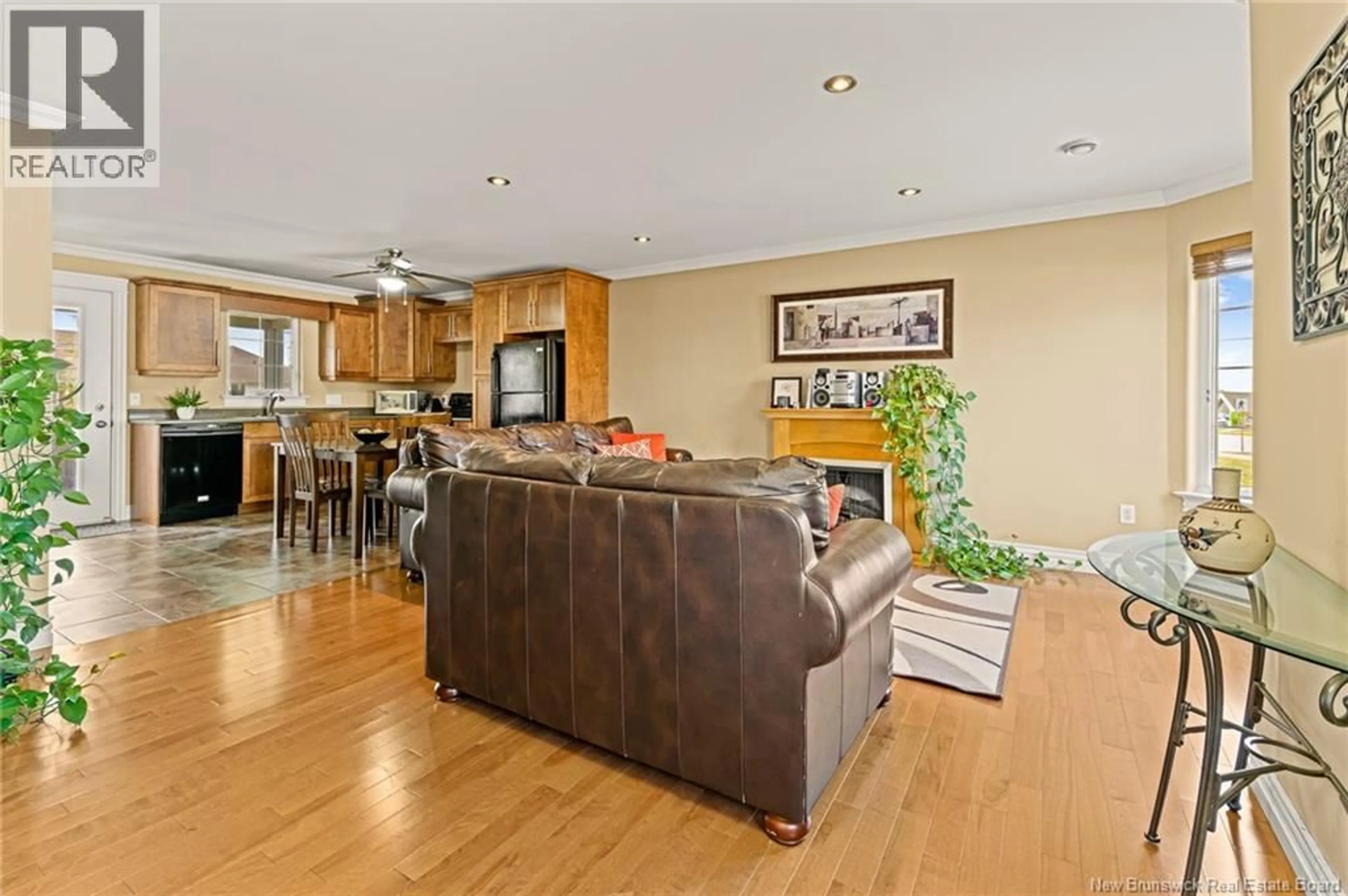 Living room with furniture, wood/laminate floor for 67 LAKEBURN, Dieppe New Brunswick E1A0Y8
