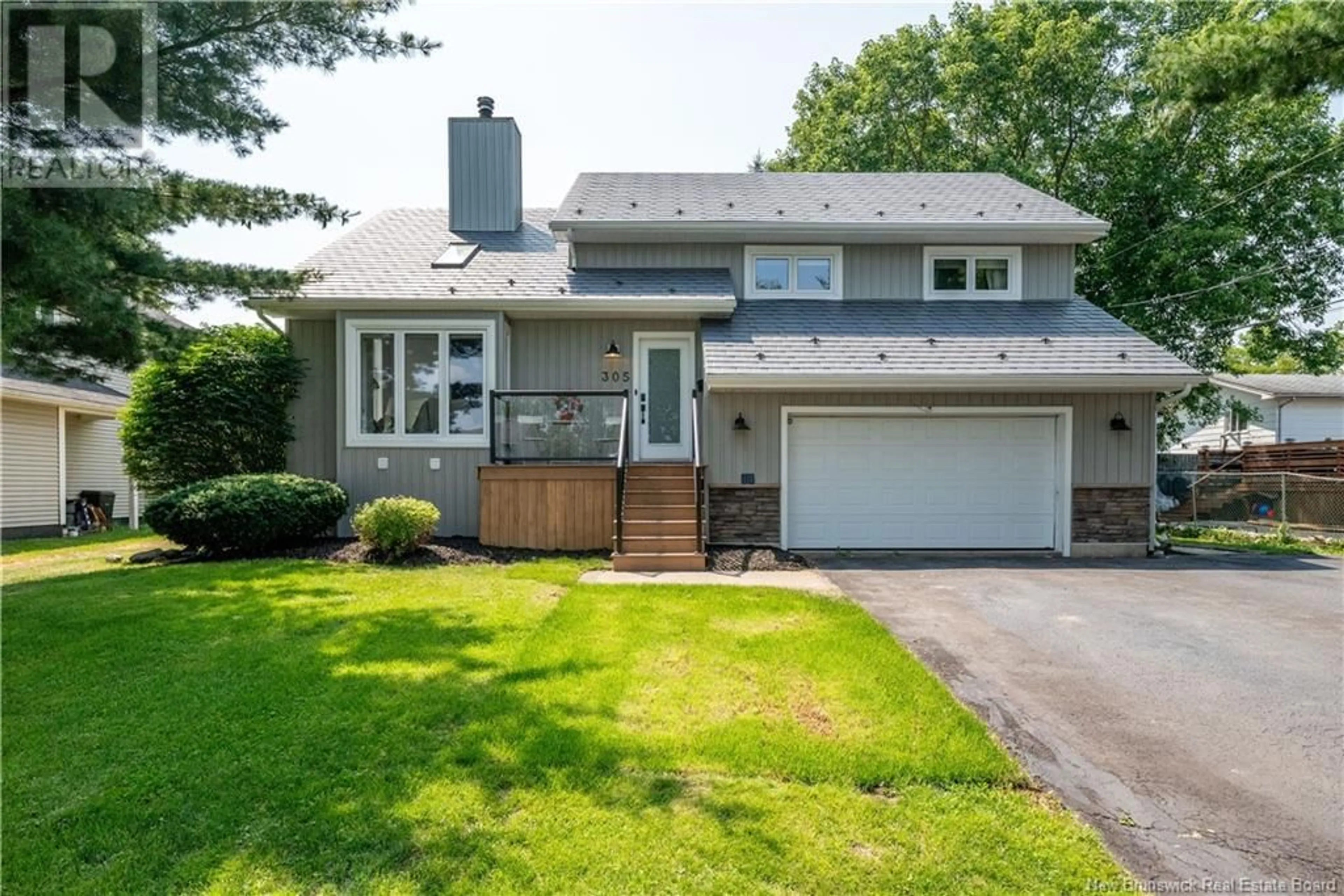 Home with vinyl exterior material, street for 305 THIBODEAU, Dieppe New Brunswick E1A1W1