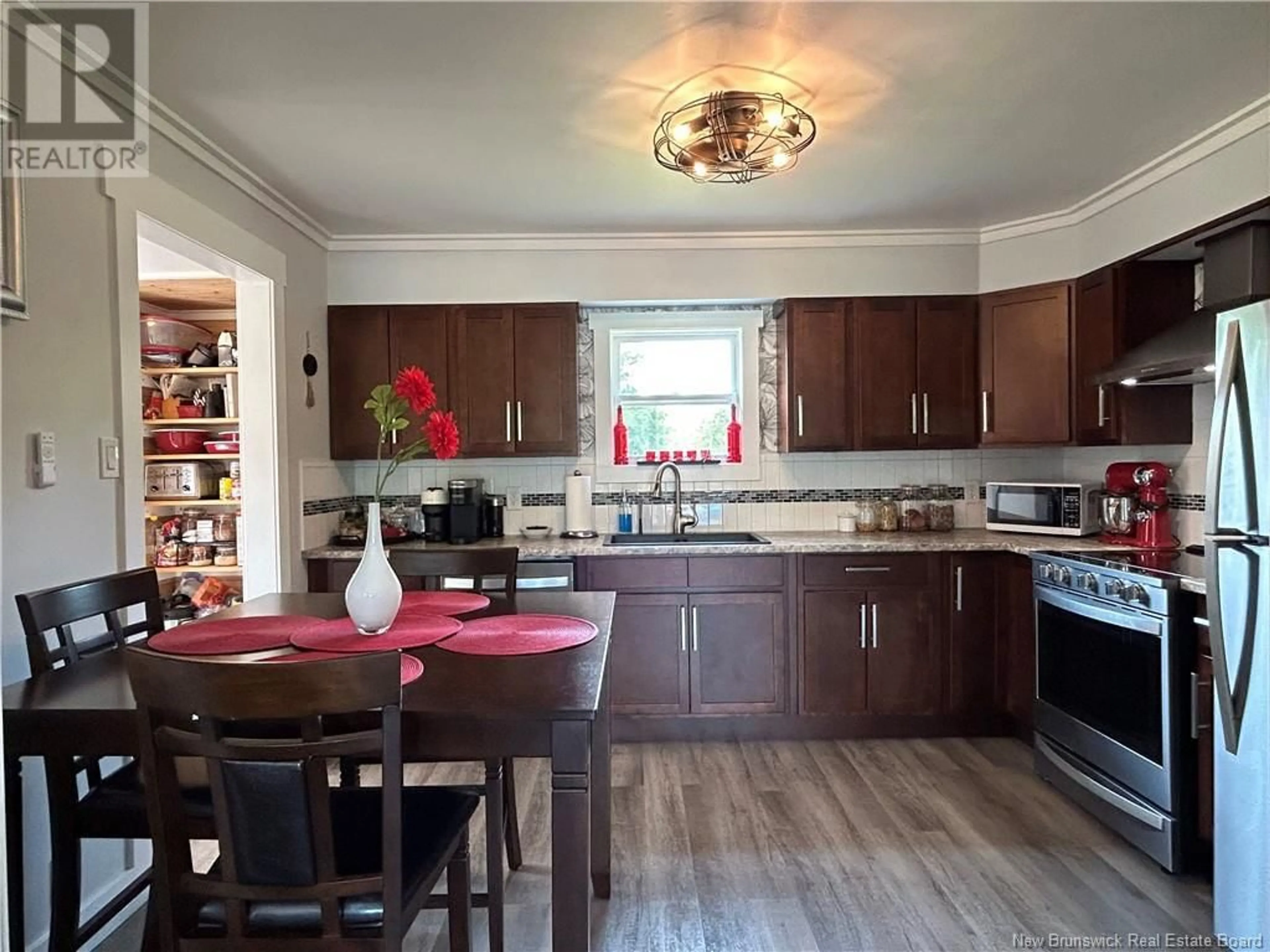 Open concept kitchen, wood/laminate floor for 5090 ROUTE 117, Baie-Sainte-Anne New Brunswick E9A1R2