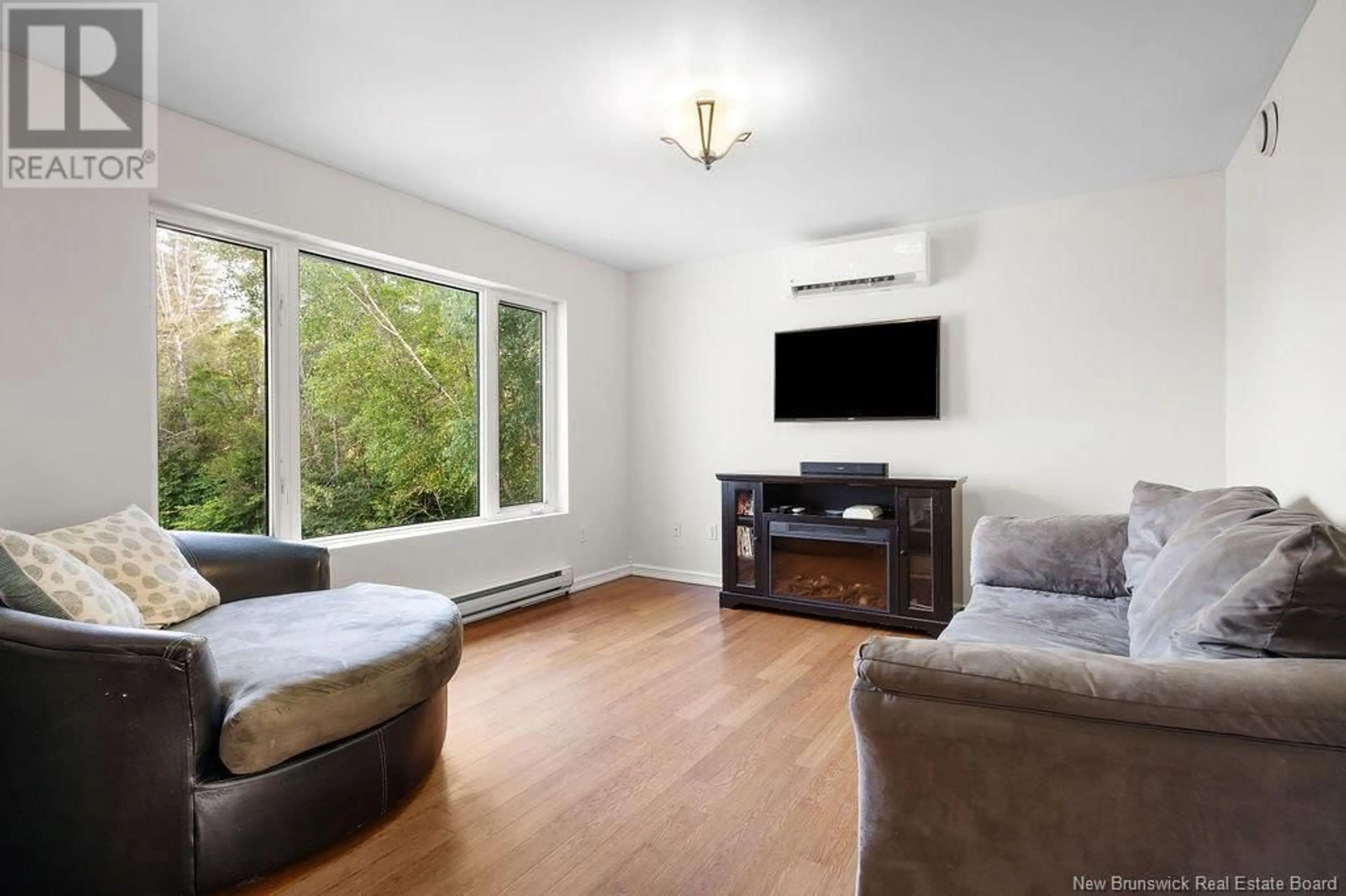 Living room with furniture, wood/laminate floor for 5083 HWY 108, Millerton New Brunswick E1V5B7