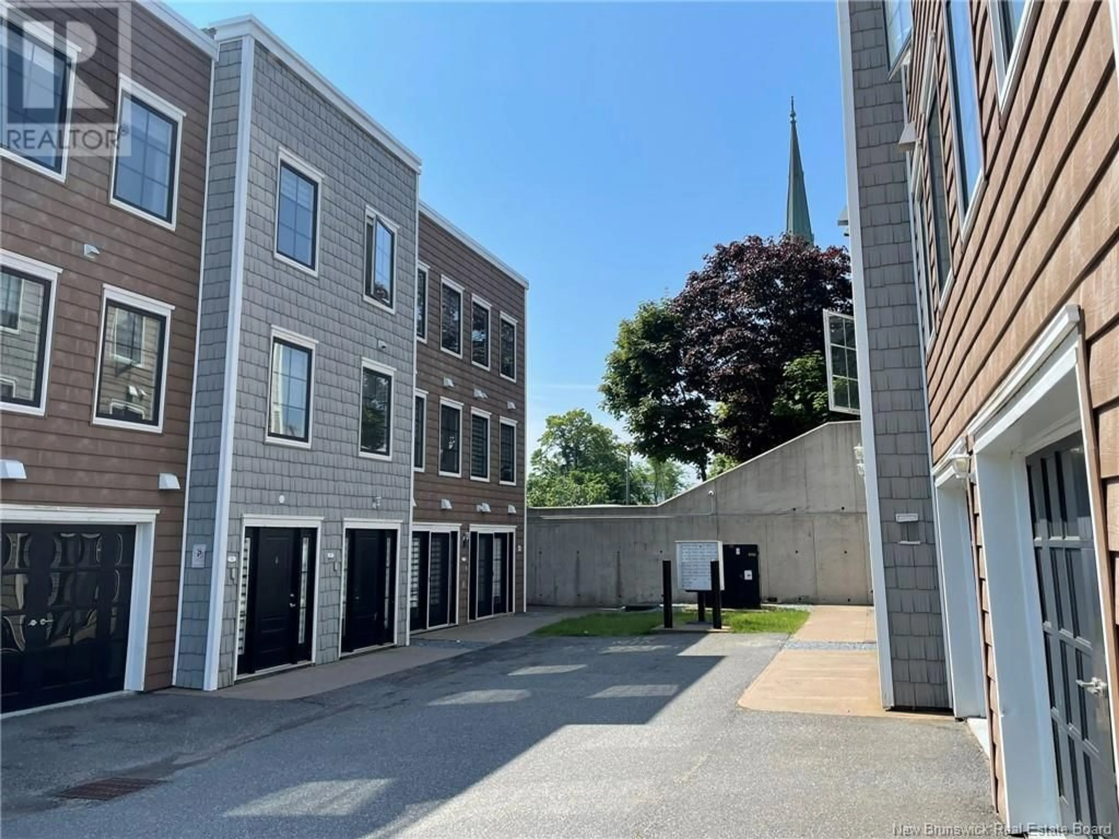A pic from outside/outdoor area/front of a property/back of a property/a pic from drone, street for 113 - 9 CATHEDRAL LANE, Saint John New Brunswick E2L0E7
