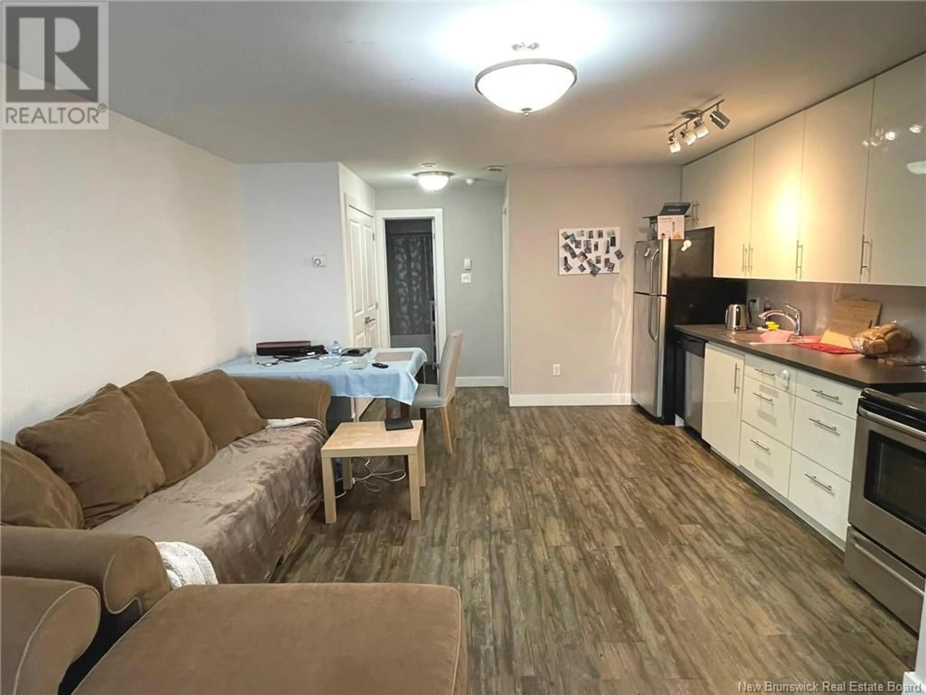 Living room with furniture, wood/laminate floor for 113 - 9 CATHEDRAL LANE, Saint John New Brunswick E2L0E7