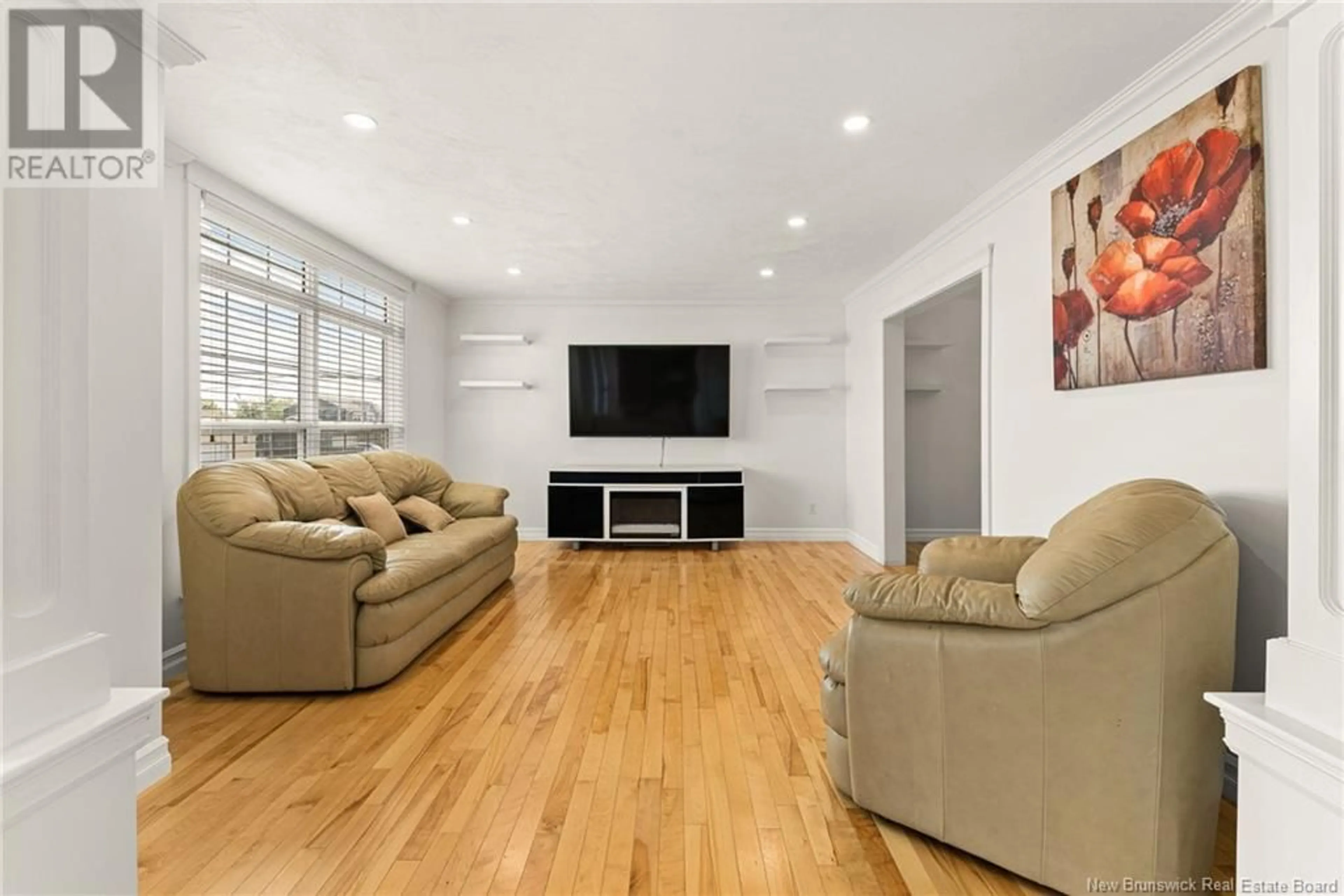 Living room with furniture, wood/laminate floor for 520 EVERGREEN DRIVE, Moncton New Brunswick E1G0K9