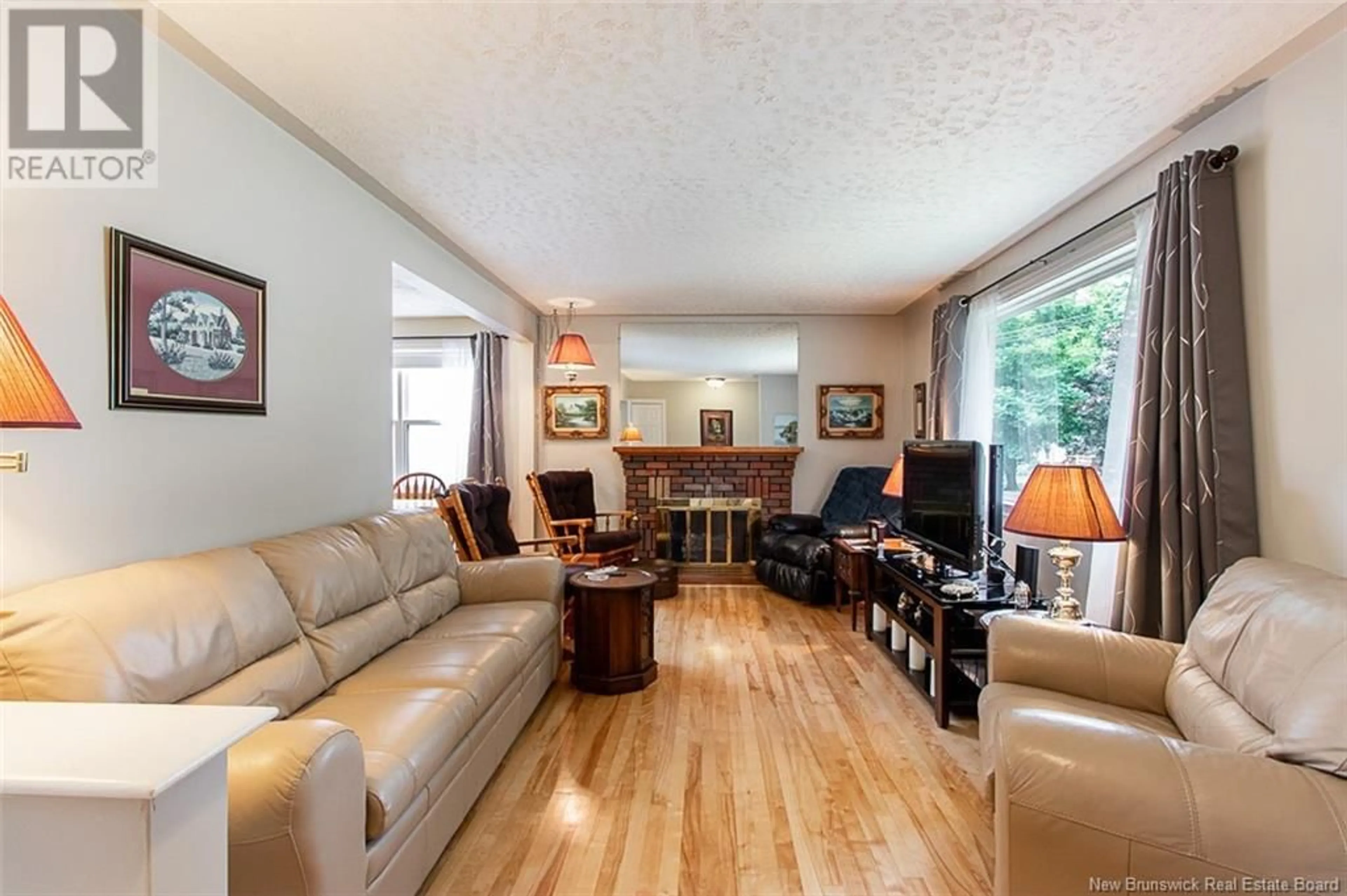Living room with furniture, wood/laminate floor for 95 CORONATION DRIVE, Moncton New Brunswick E1E2X3